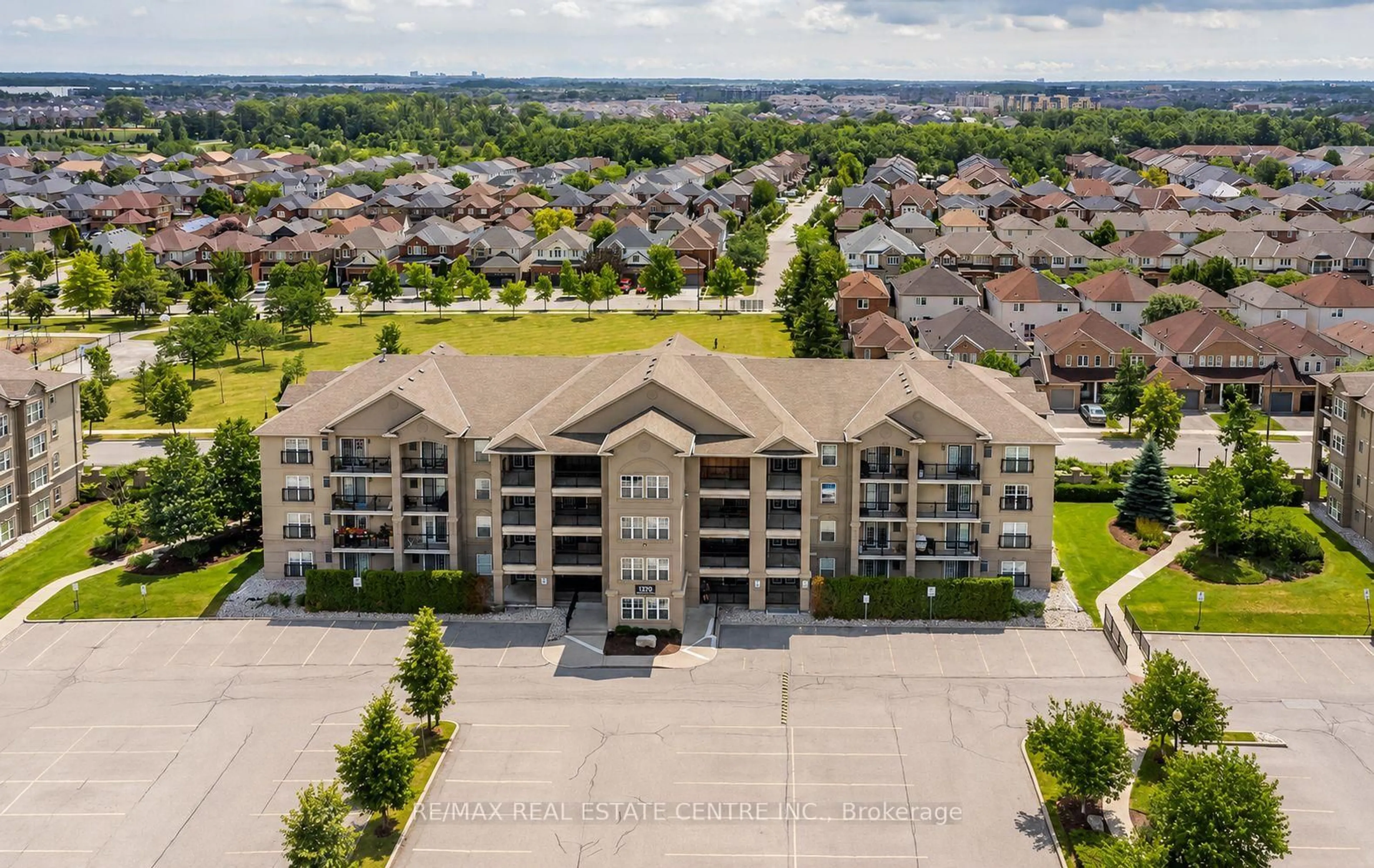 A pic from outside/outdoor area/front of a property/back of a property/a pic from drone, unknown for 1370 Main St #205, Milton Ontario L9T 7S8