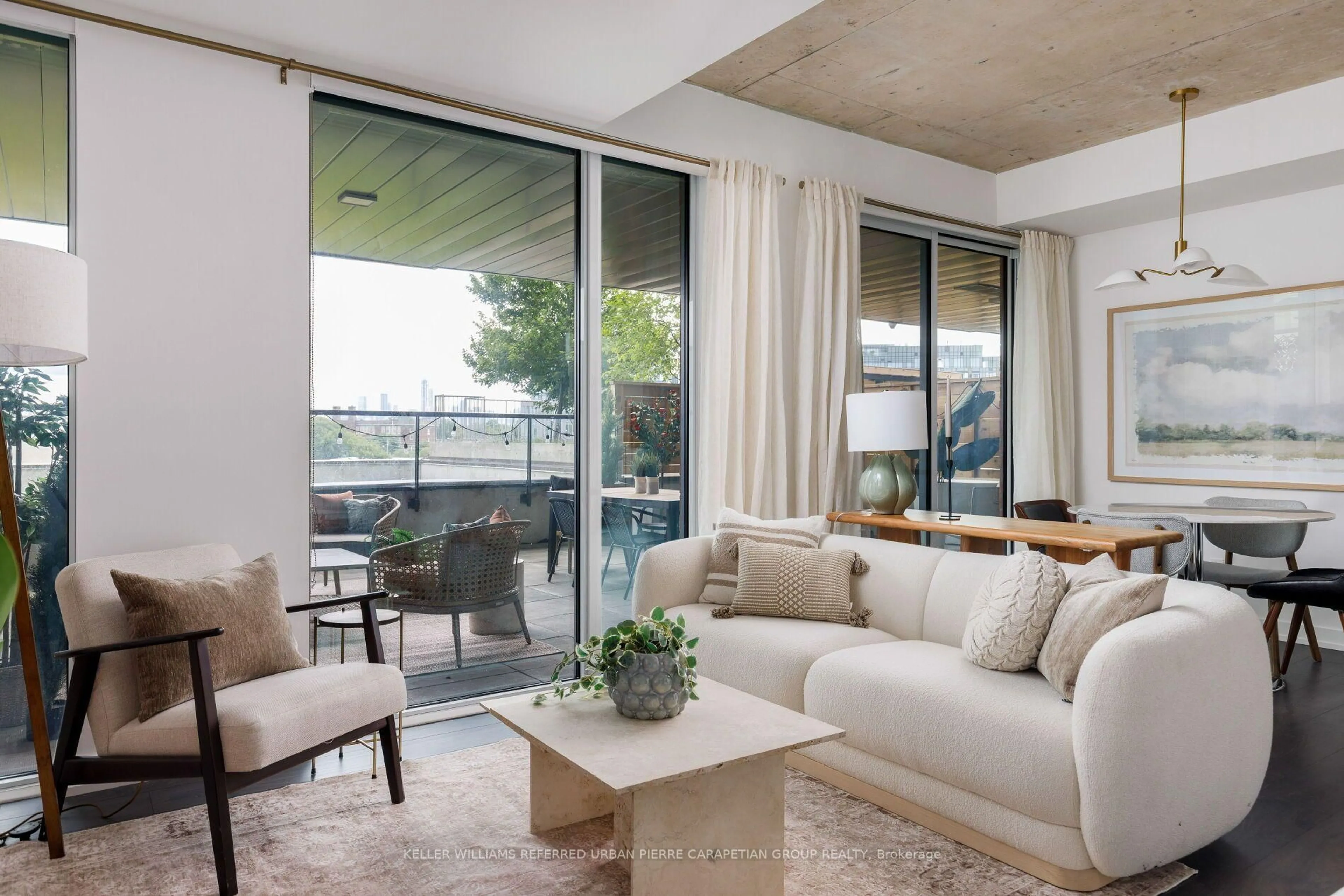 Living room with furniture, cement floor for 57 Brock Ave #312, Toronto Ontario M6K 2L3