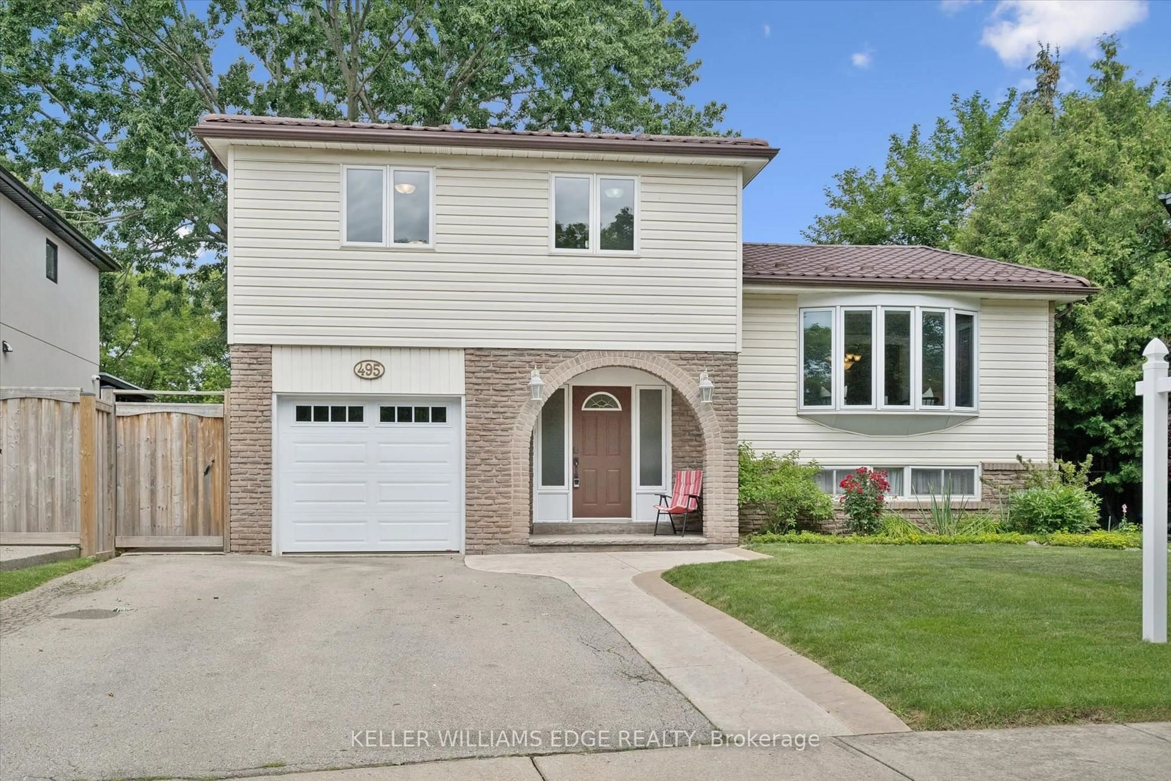Home with brick exterior material, street for 495 Tipperton Cres, Oakville Ontario L6L 5E1