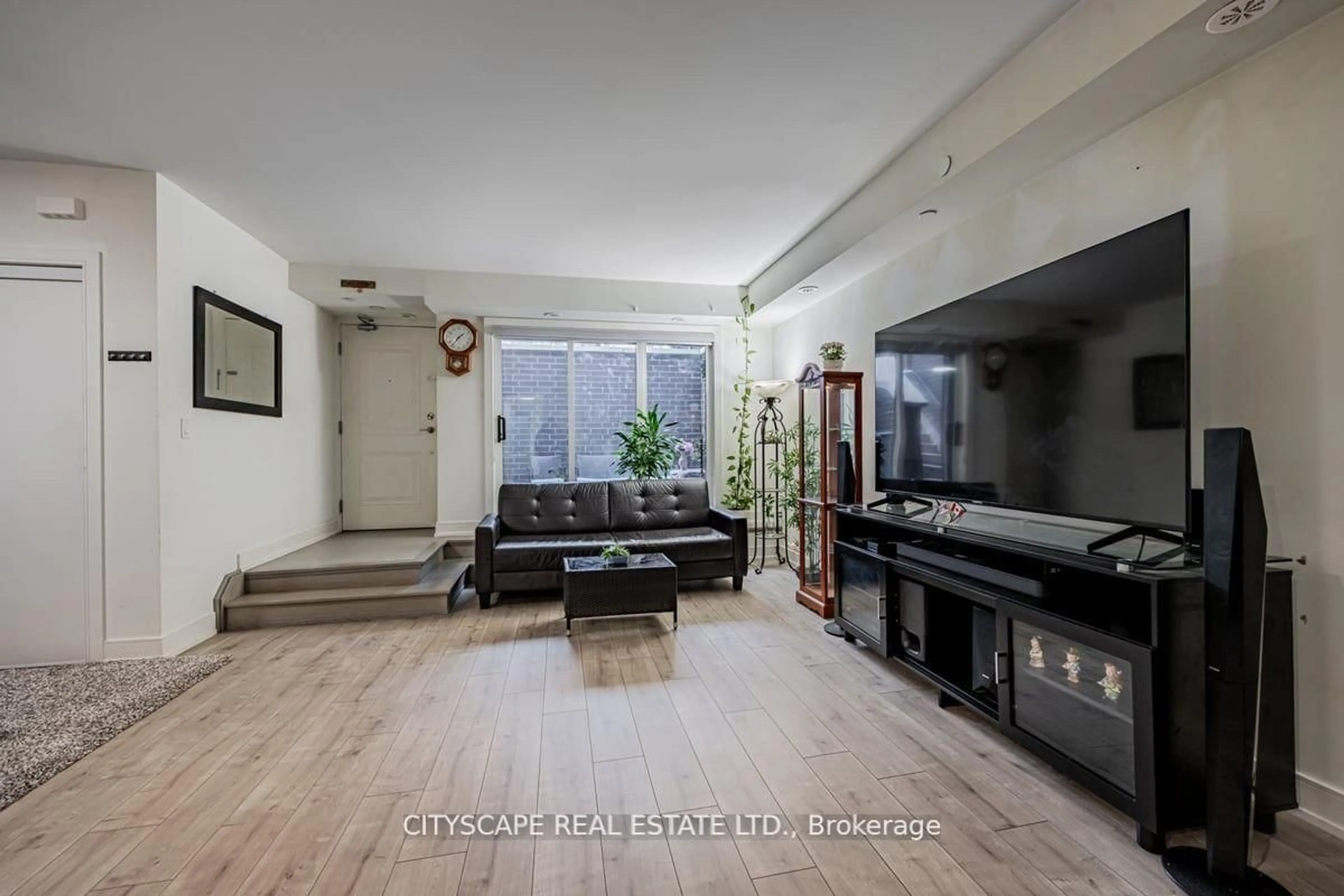 Living room with furniture, unknown for 66 Longbranch Ave #1, Toronto Ontario M8W 3J4