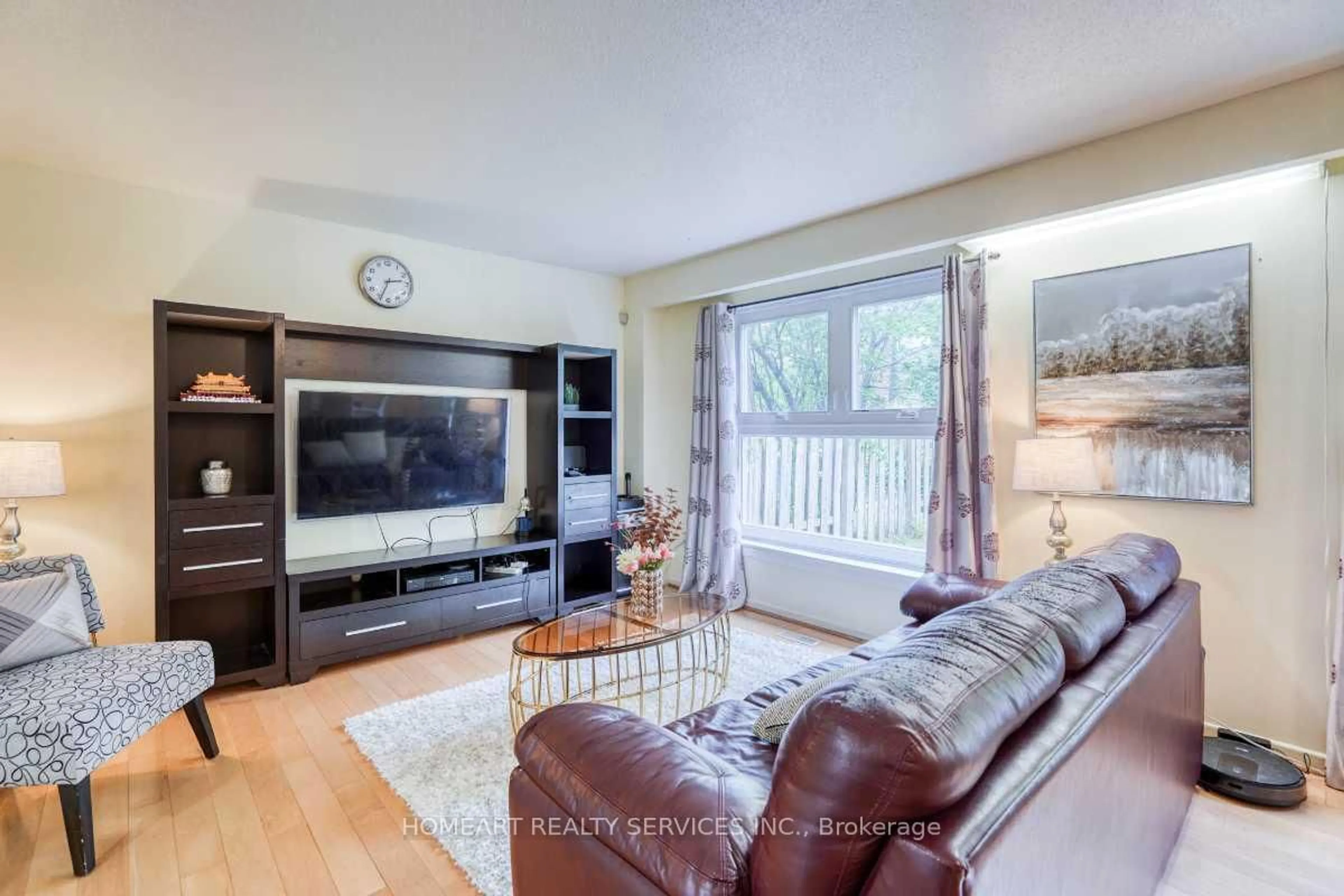 Living room with furniture, wood/laminate floor for 27 Gosford Blvd #1, Toronto Ontario M3N 2G7