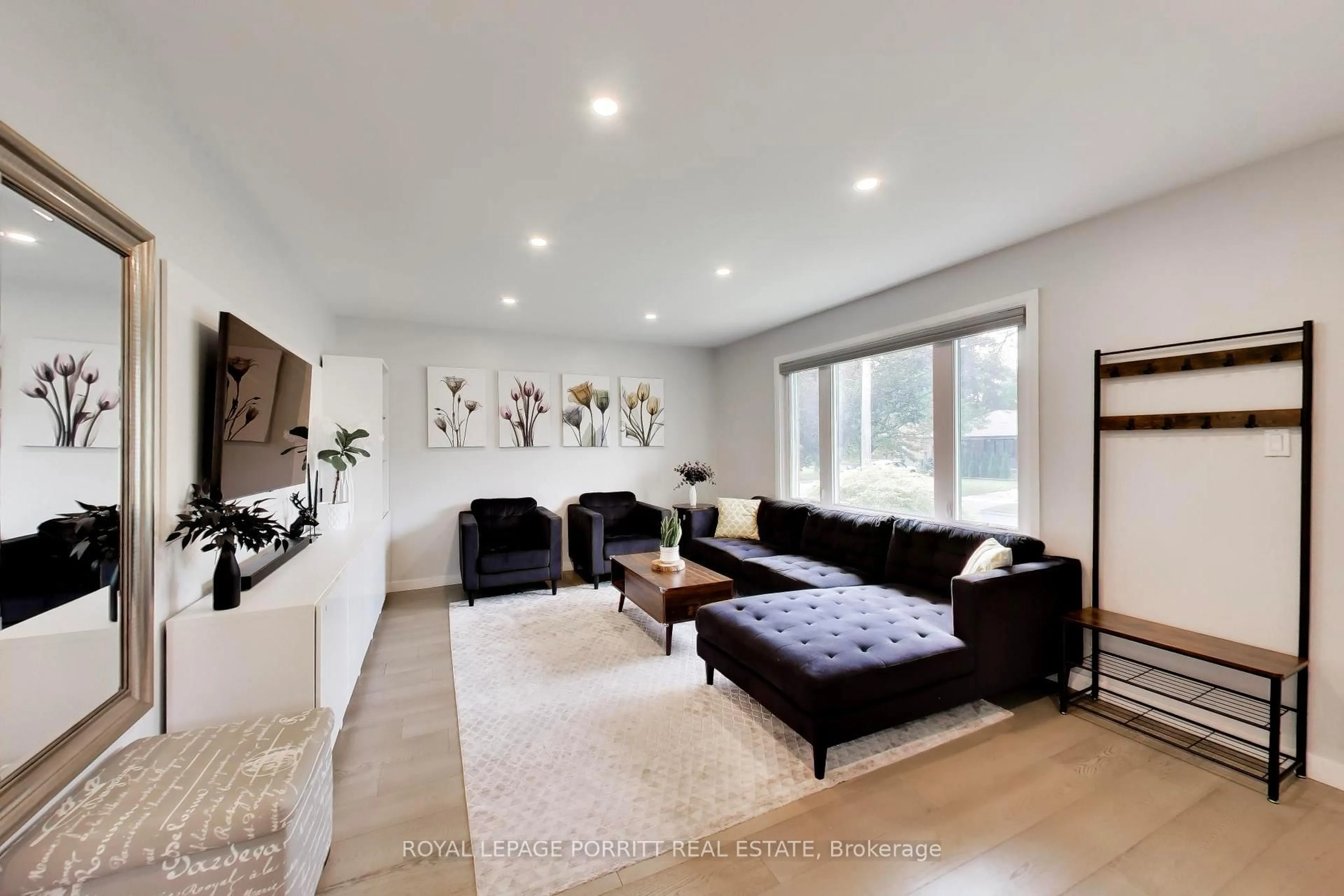 Living room with furniture, wood/laminate floor for 344 Rimilton Ave, Toronto Ontario M8W 2E6
