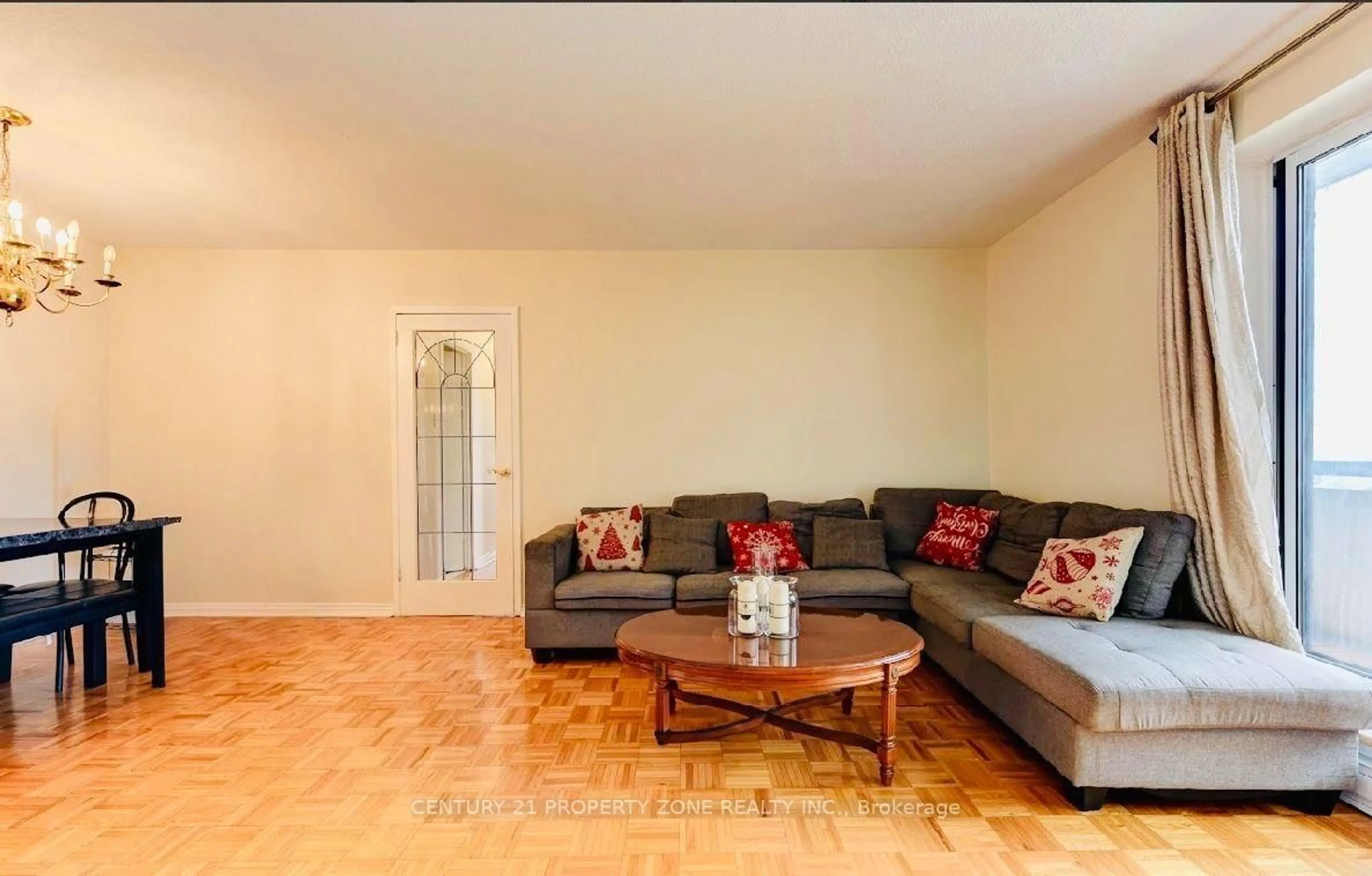 Living room with furniture, wood/laminate floor for 3025 Queen Frederica Dr #907, Mississauga Ontario L4Y 3A1