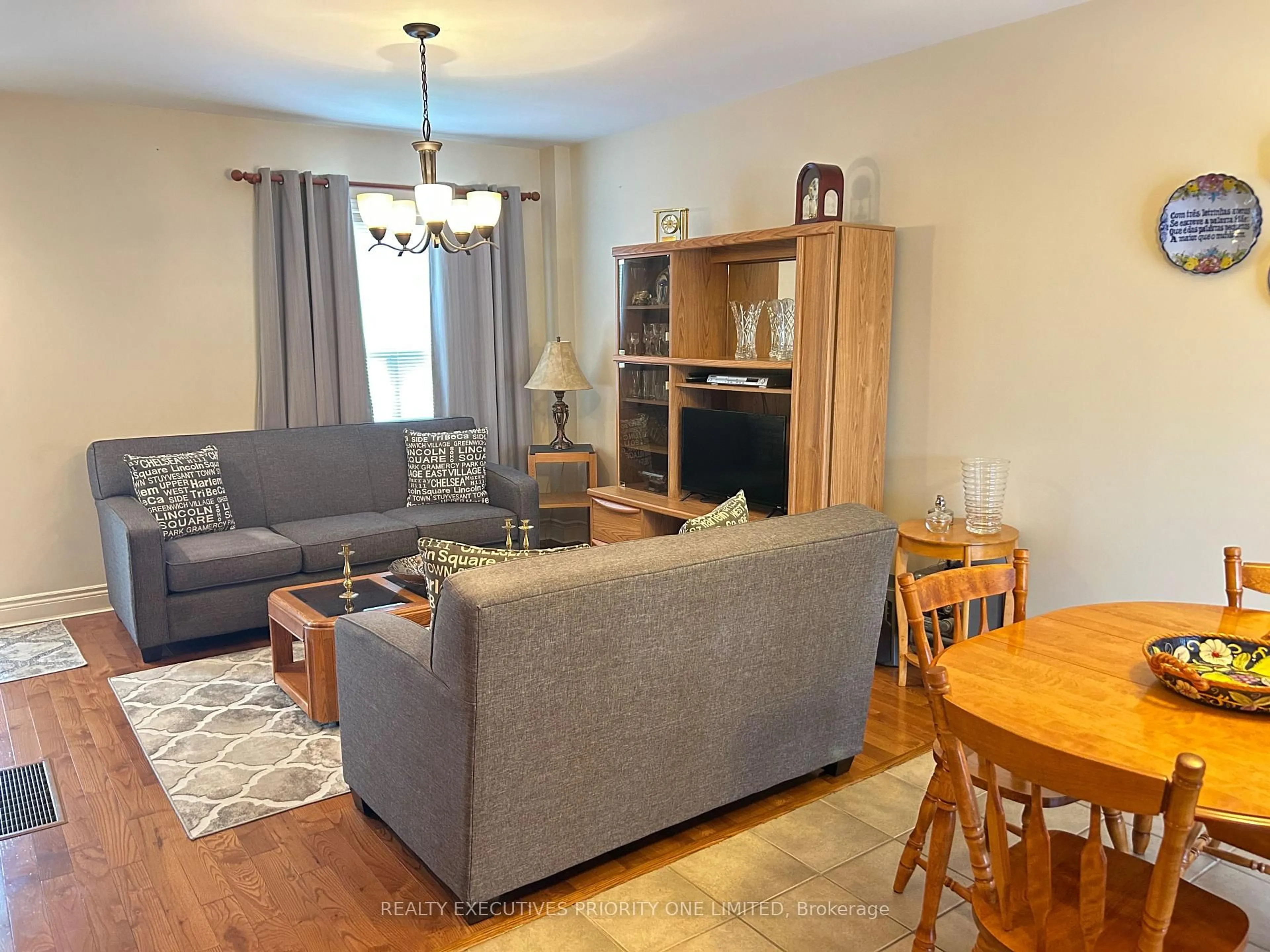 Living room with furniture, wood/laminate floor for 224 Caledonia Rd, Toronto Ontario M6E 4T1