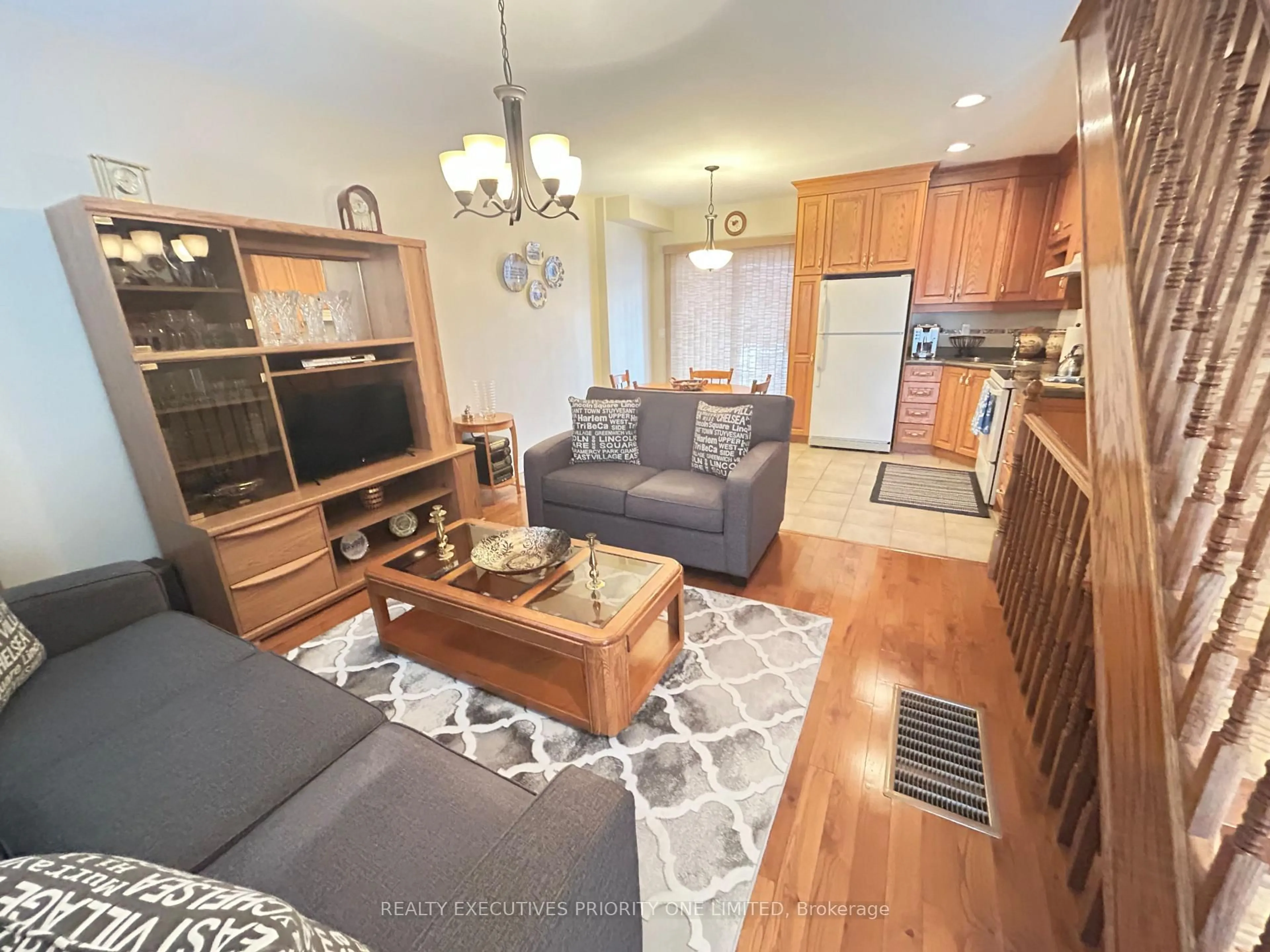 Living room with furniture, wood/laminate floor for 224 Caledonia Rd, Toronto Ontario M6E 4T1
