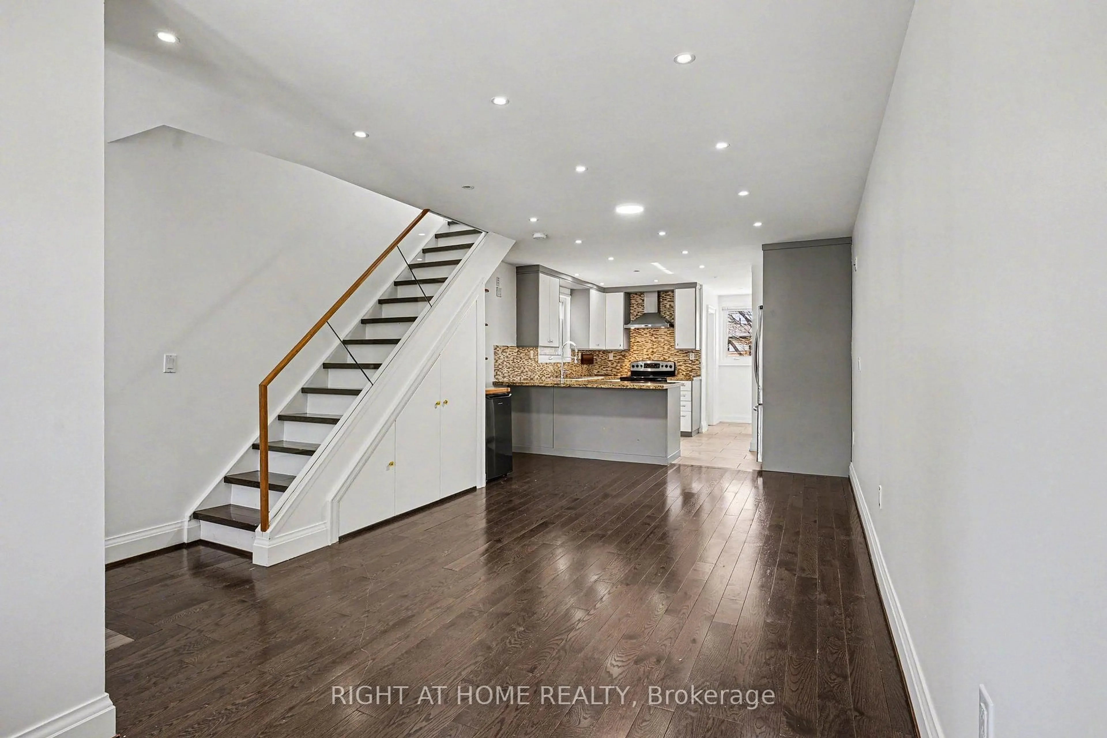 Open concept kitchen, wood/laminate floor for 174 Rosethorn Ave, Toronto Ontario M6N 3L4