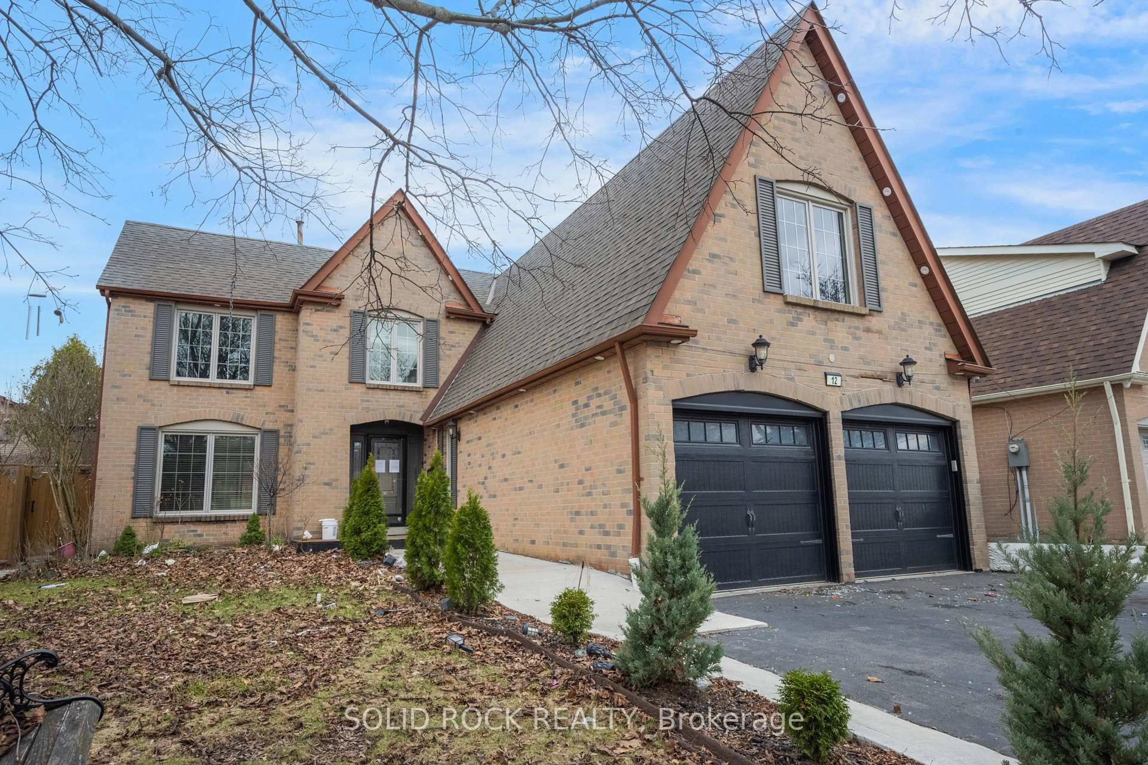 Home with brick exterior material, street for 12 Torrance Woods, Brampton Ontario L6Y 2N3