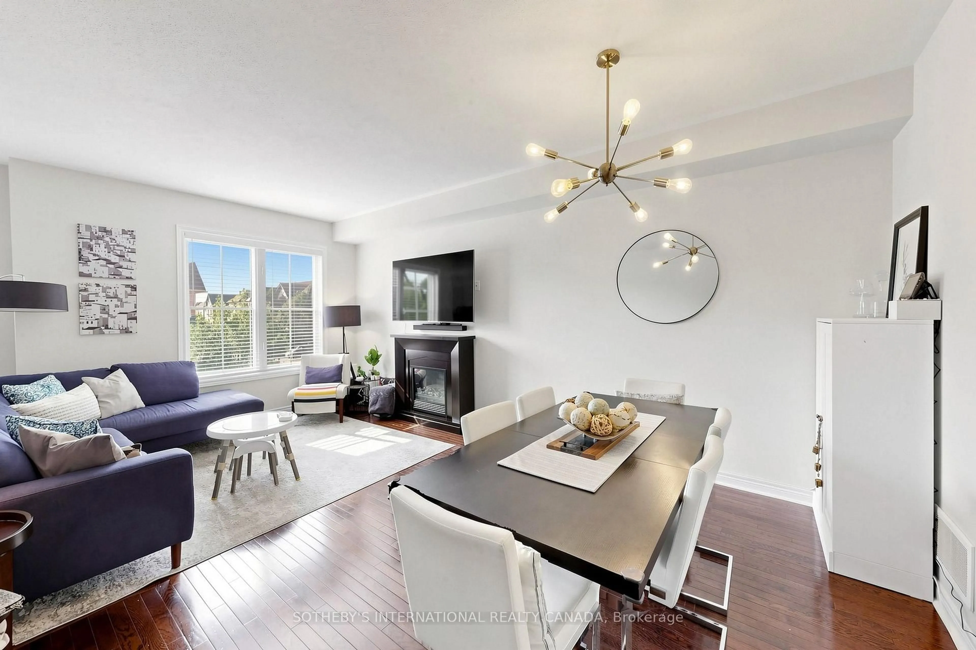 Living room with furniture, wood/laminate floor for 38 Cedar Lake Cres, Brampton Ontario L6Y 0P9