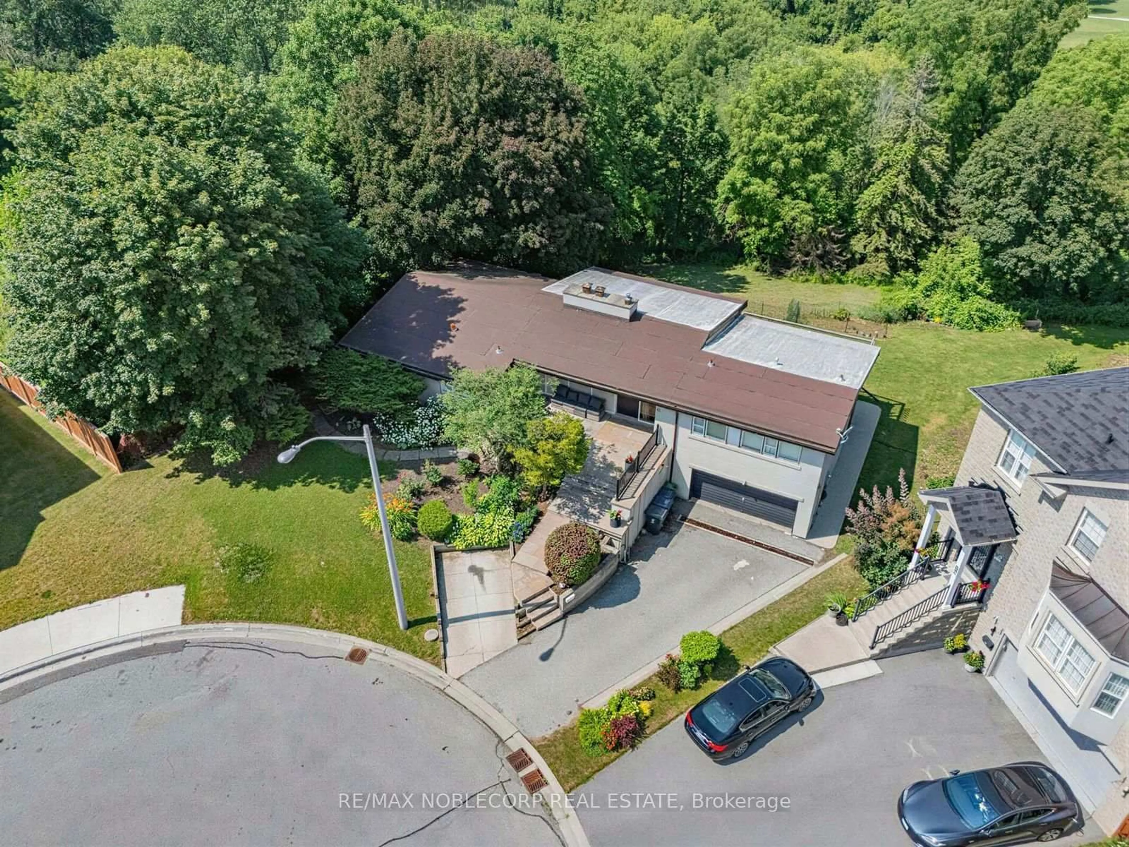 A pic from outside/outdoor area/front of a property/back of a property/a pic from drone, street for 12 George McKenzie Crt, Toronto Ontario M9M 0E1