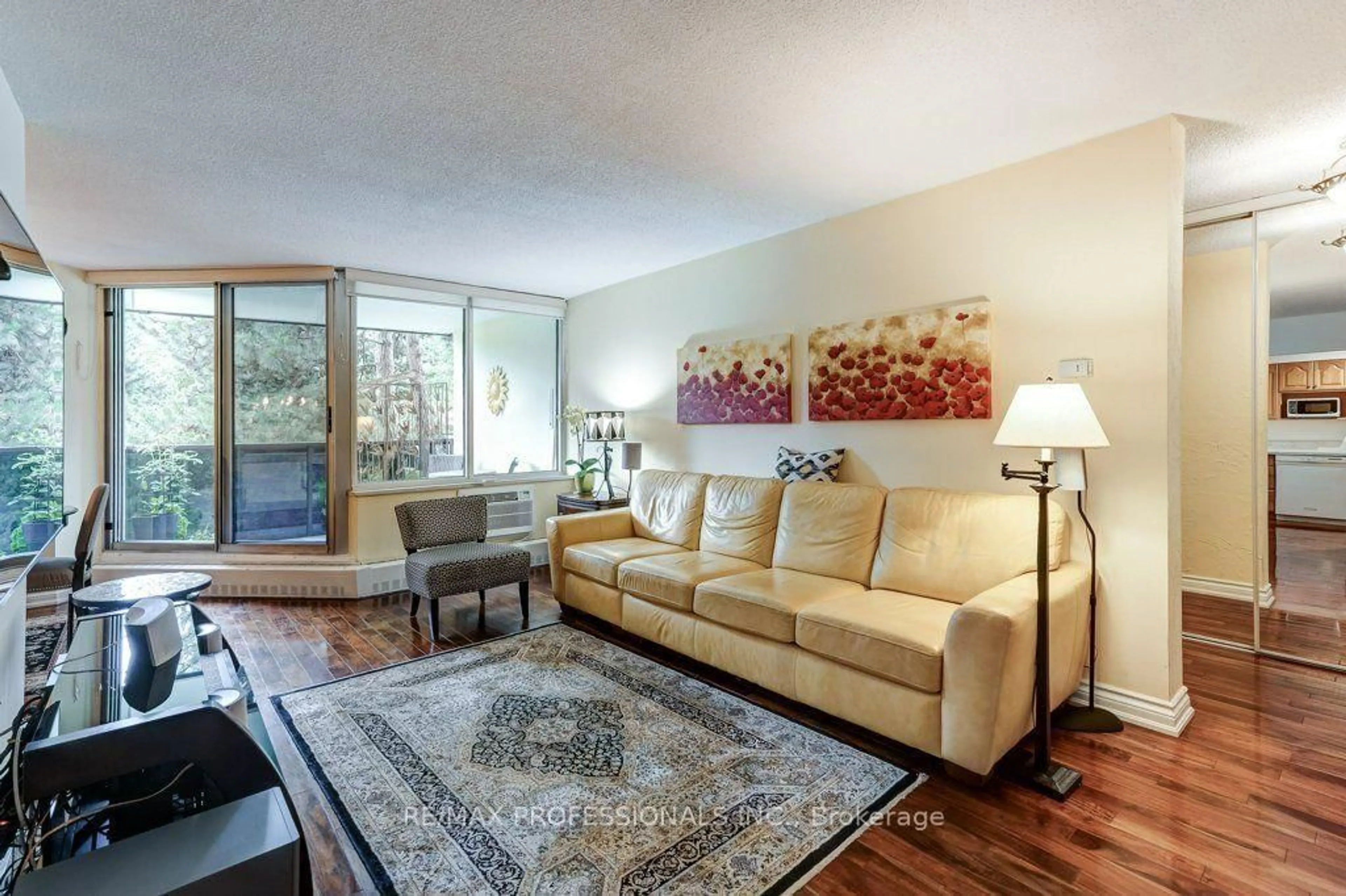 Living room with furniture, unknown for 420 Mill Rd #112, Toronto Ontario M9C 1Z1
