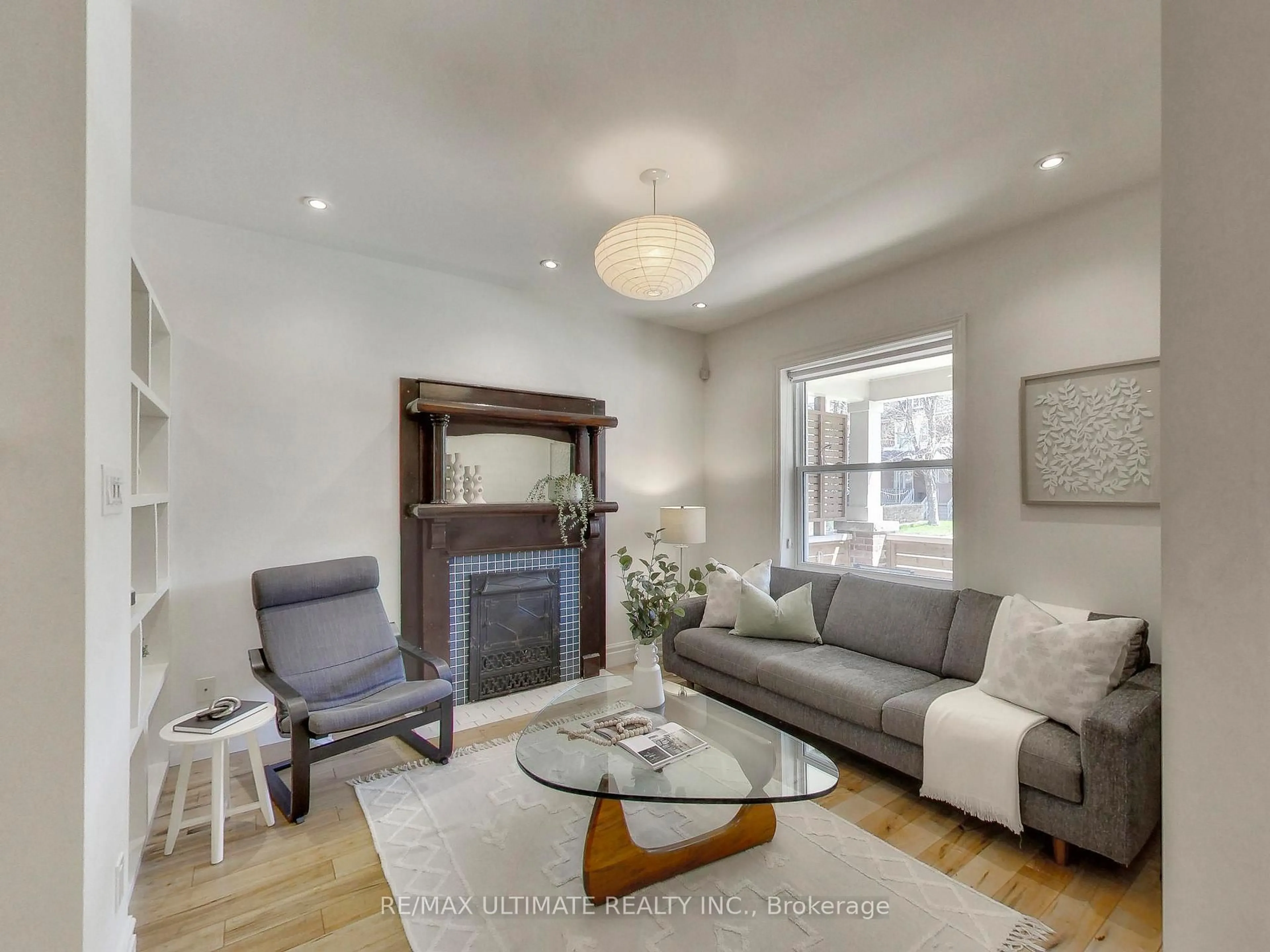 Living room with furniture, wood/laminate floor for 24 Pauline Ave, Toronto Ontario M6H 3M8