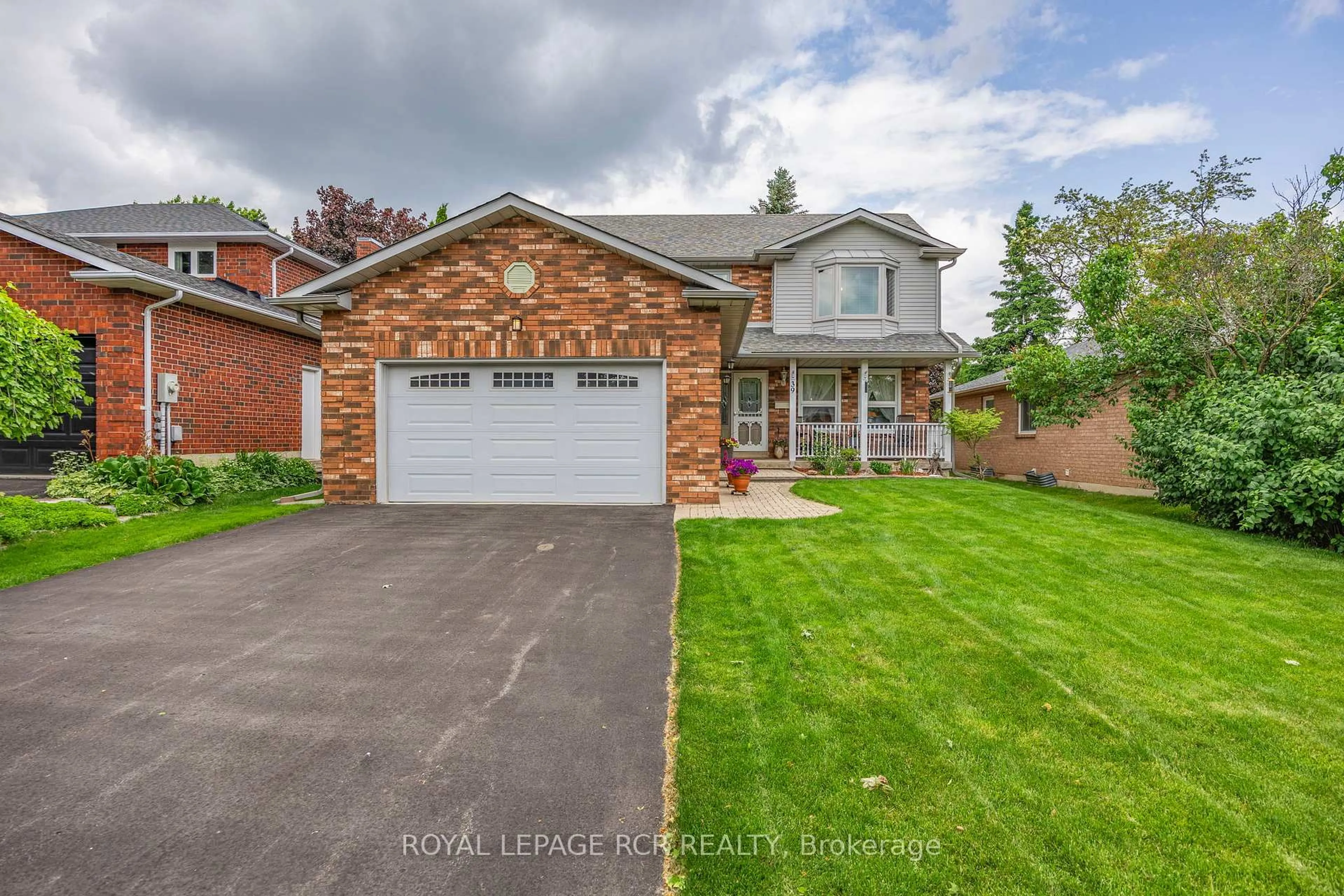 Home with brick exterior material, street for 39 Passmore Ave, Orangeville Ontario L9W 4K4