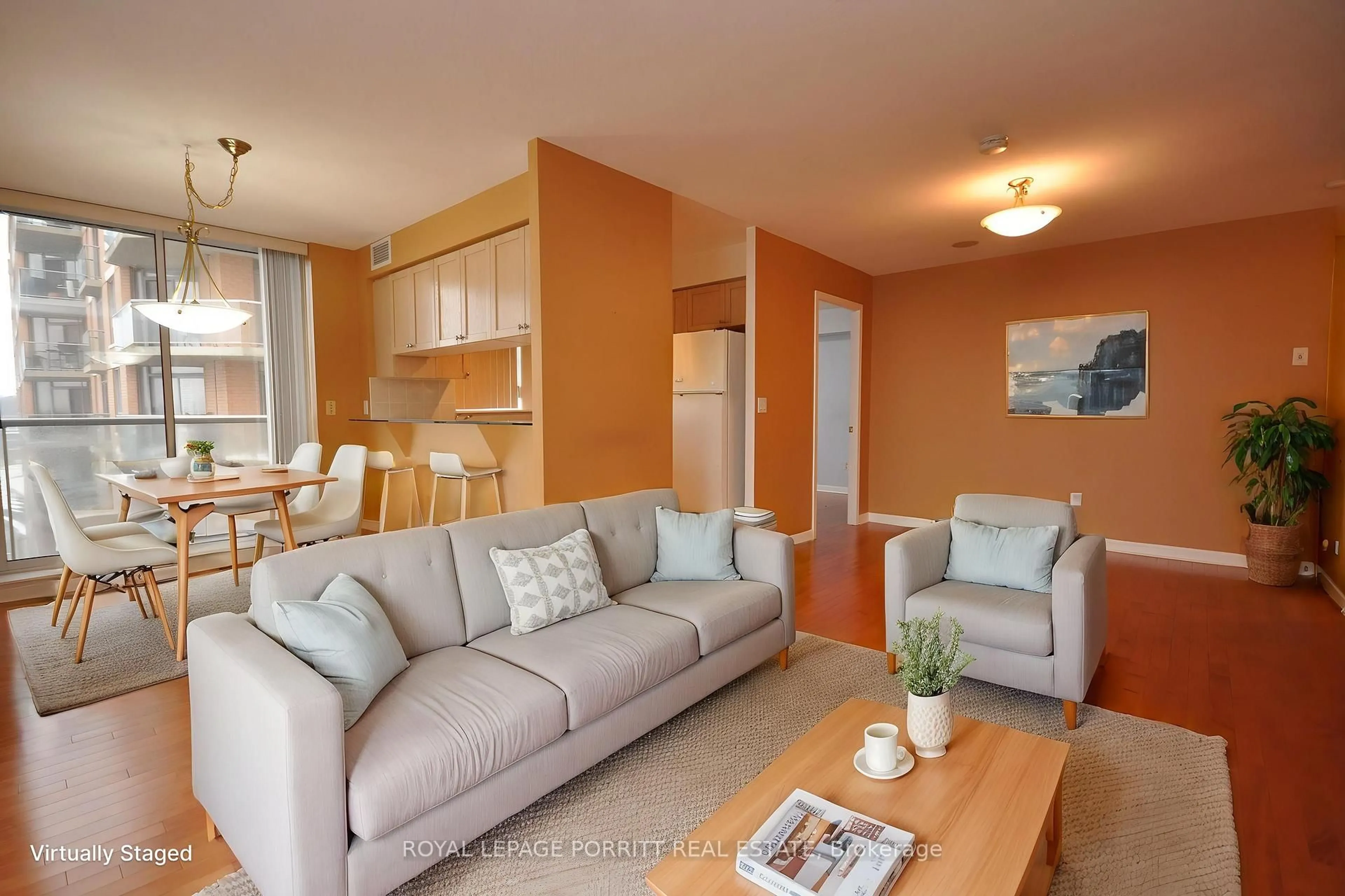Living room with furniture, wood/laminate floor for 1140 Parkwest Pl #901, Mississauga Ontario L5E 3K9