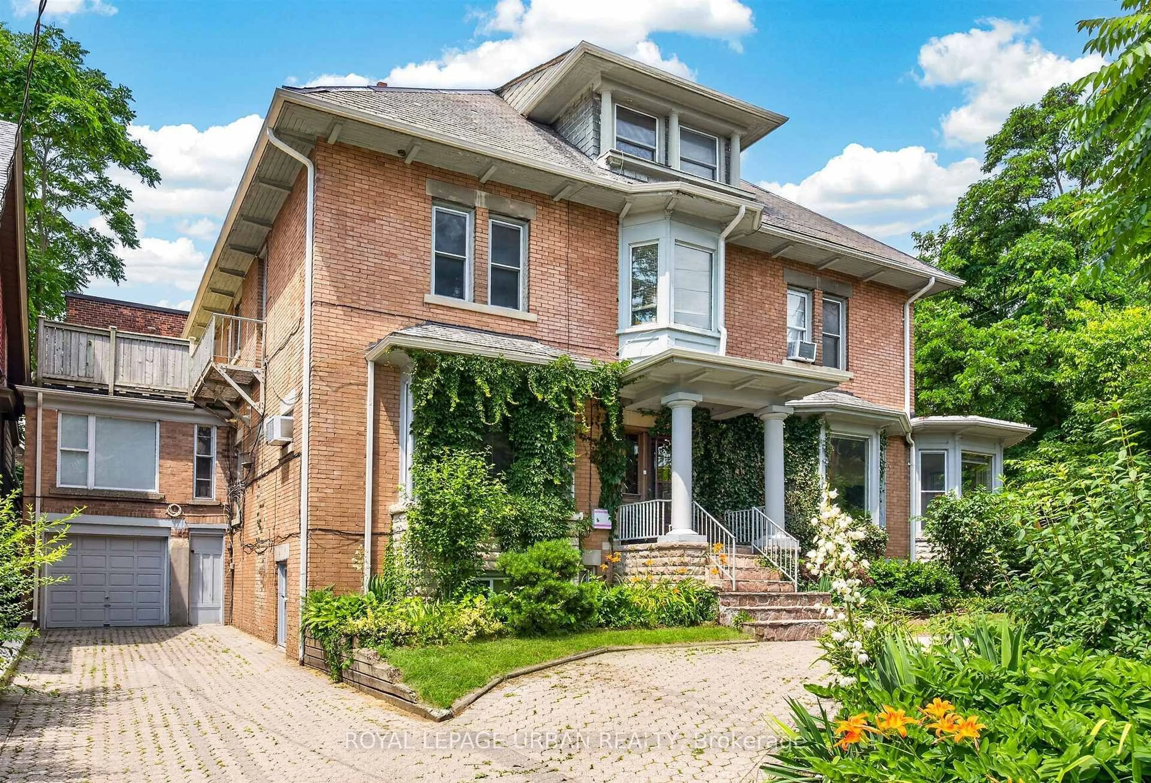 Home with brick exterior material, street for 244 Indian Rd, Toronto Ontario M6R 2W9