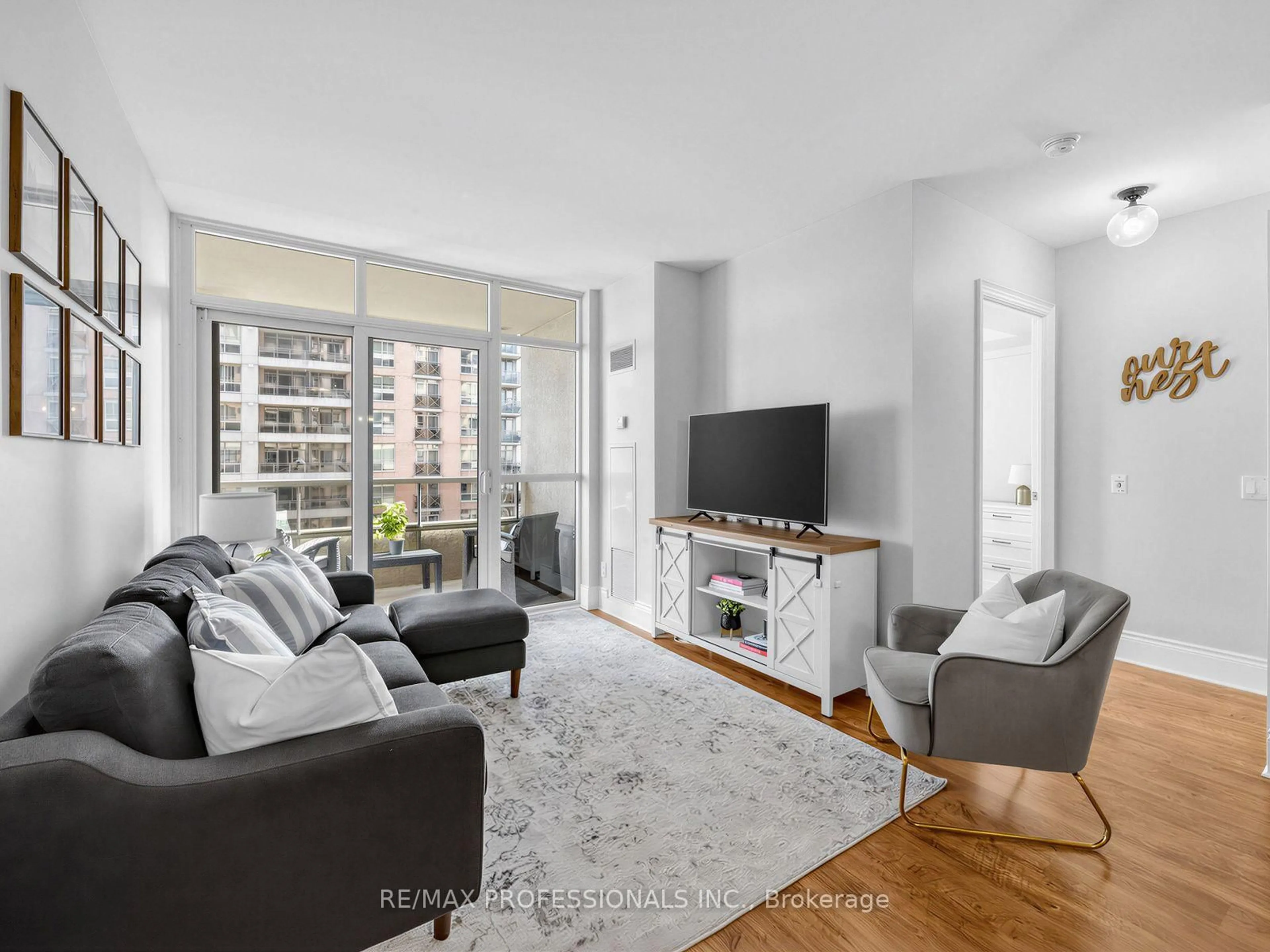 Living room with furniture, unknown for 5233 Dundas St #1123, Toronto Ontario M9B 6M1