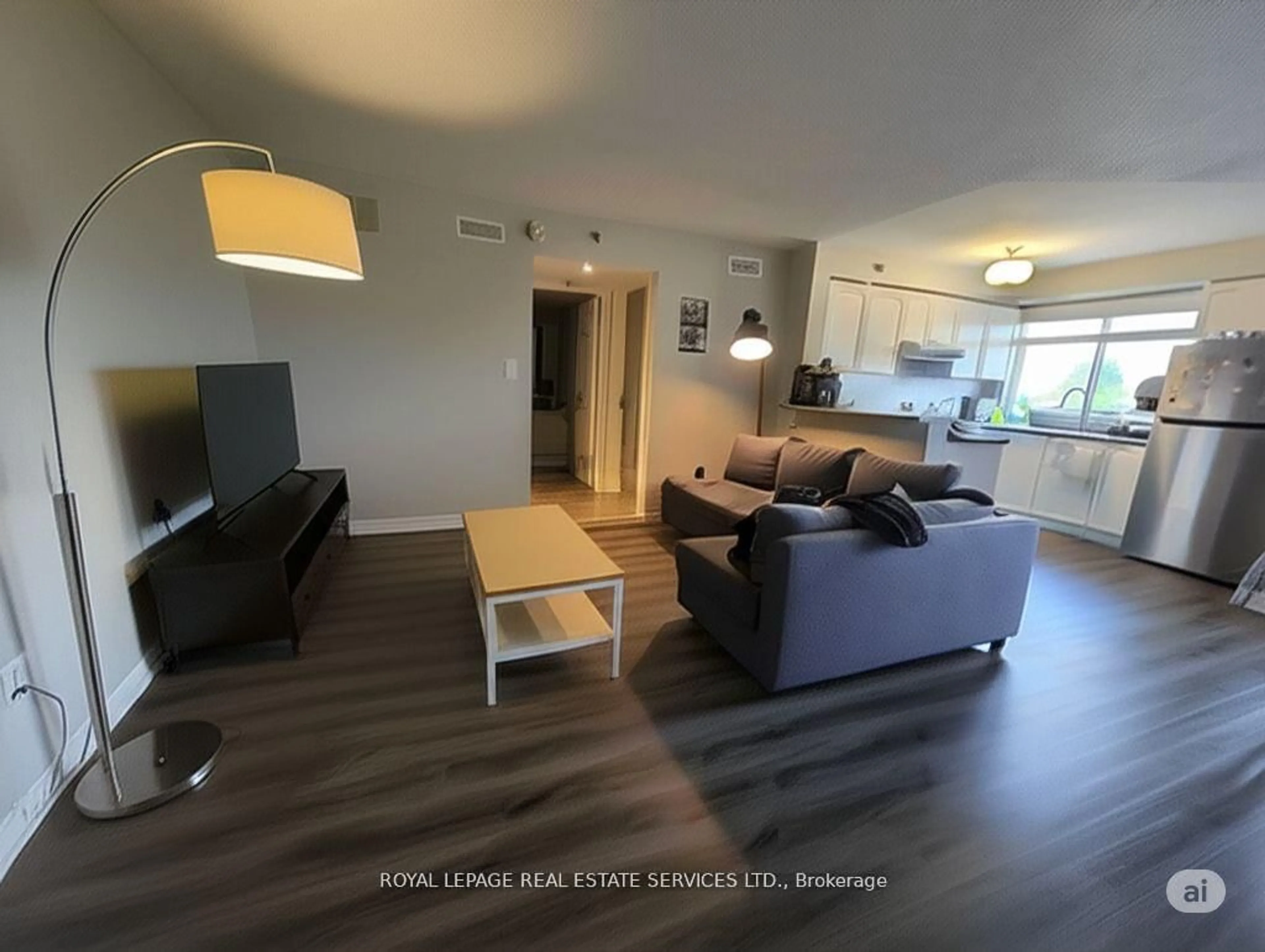Living room with furniture, wood/laminate floor for 4450 Fairview St #406, Burlington Ontario L7L 7K7