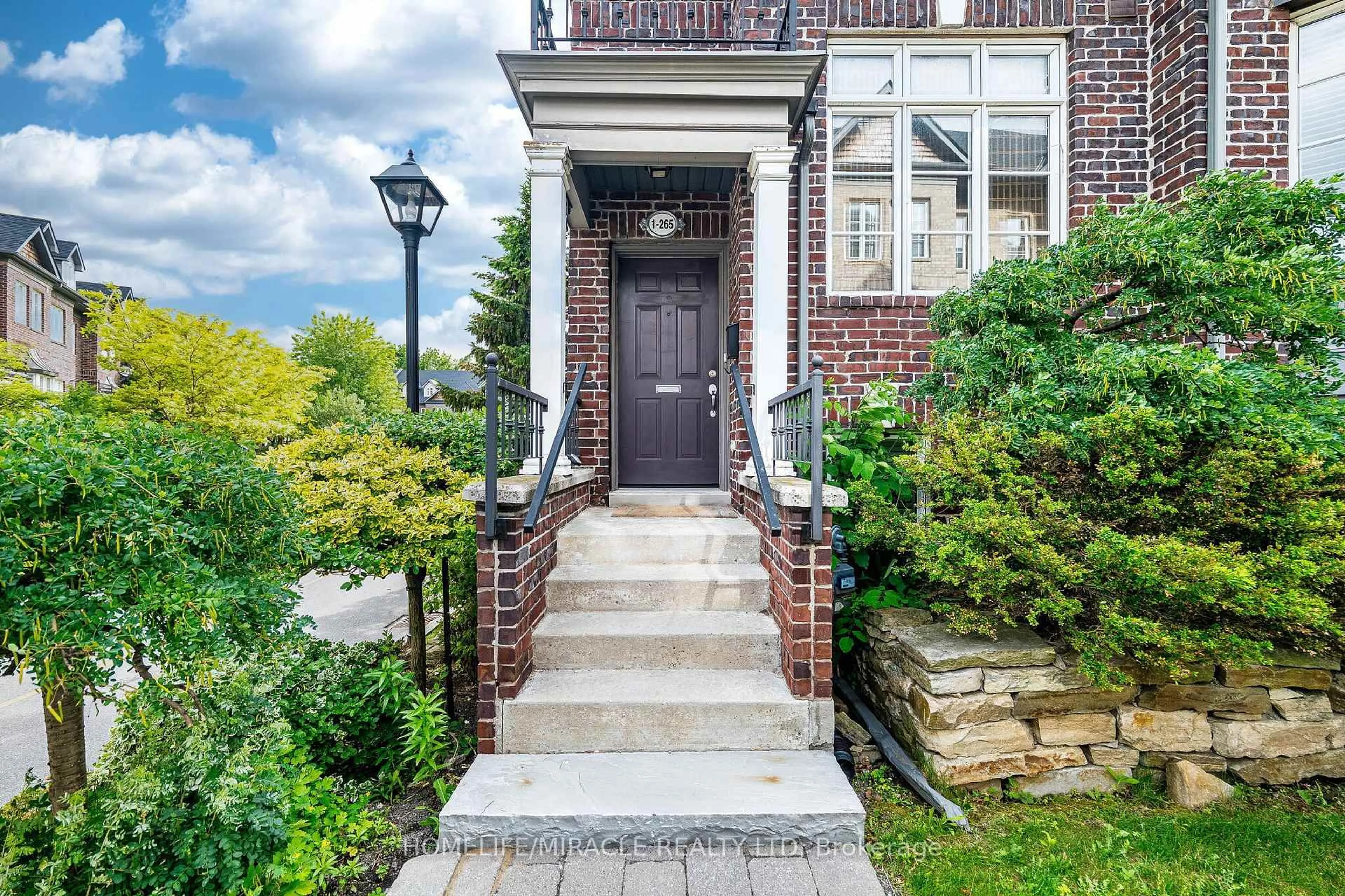 Home with brick exterior material, street for 265 Van Dusen Blvd #1, Toronto Ontario M8Z 3J2
