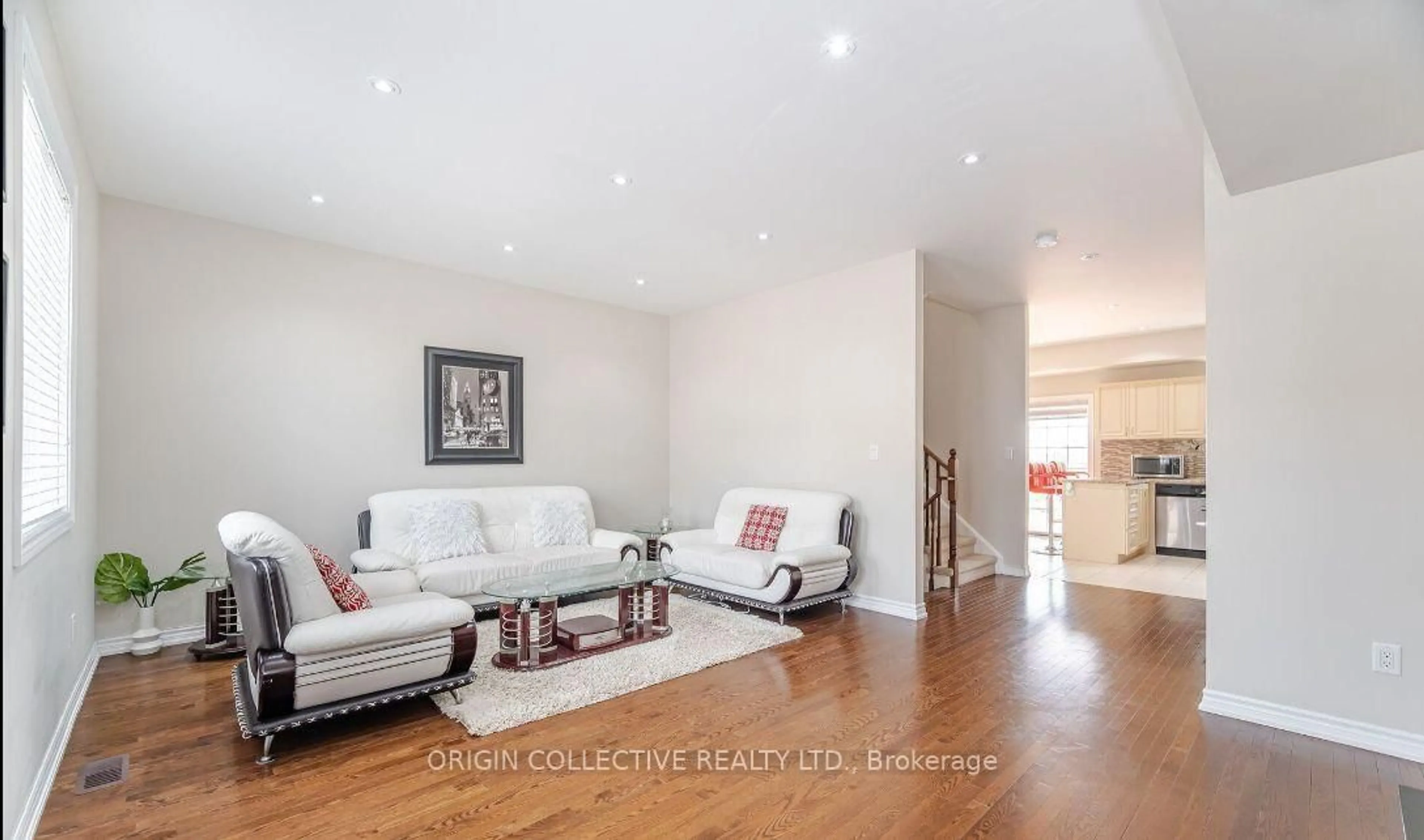 Living room with furniture, wood/laminate floor for 2530 Countryside Dr #5, Brampton Ontario L6R 3T4