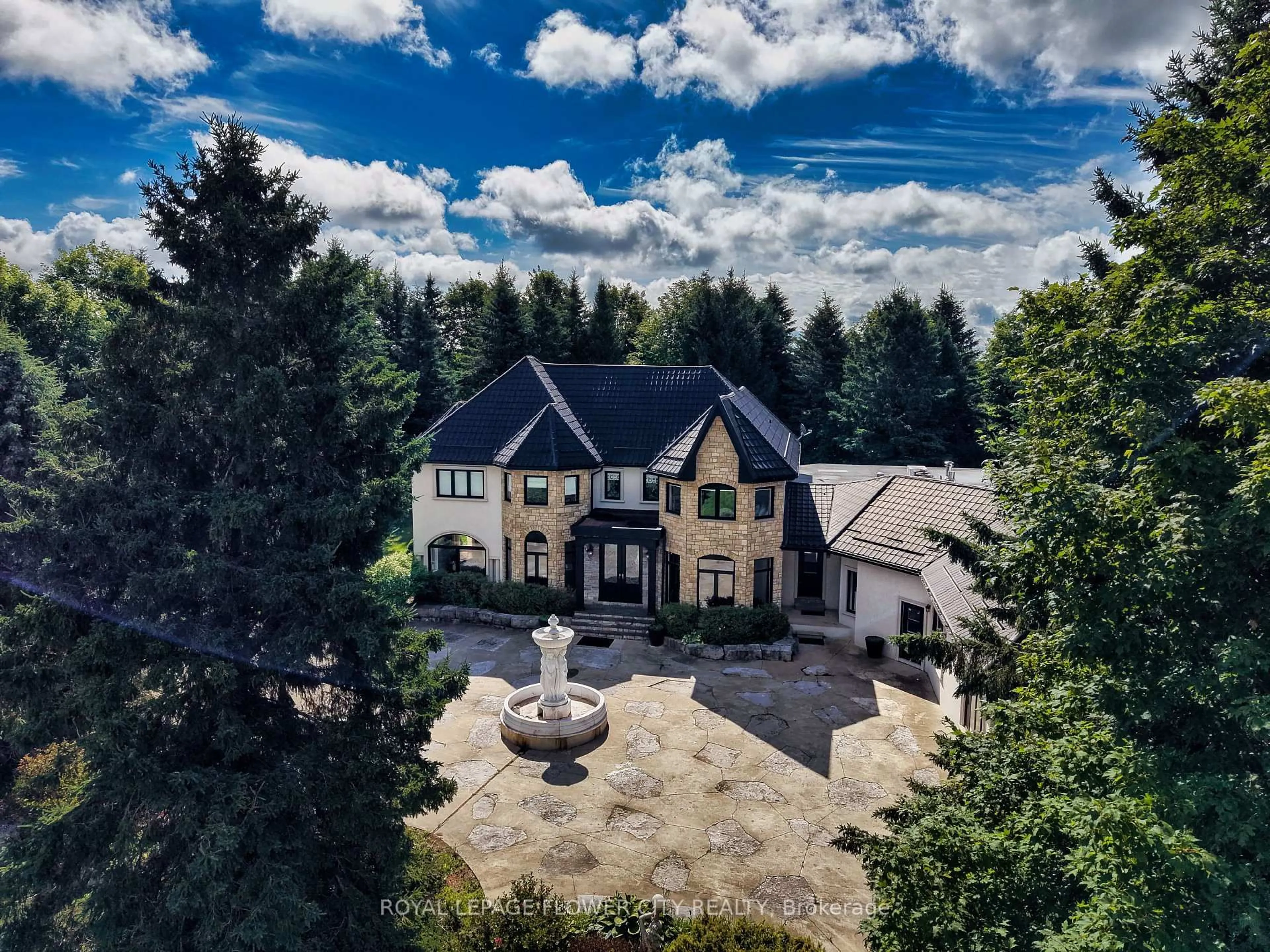 A pic from outside/outdoor area/front of a property/back of a property/a pic from drone, mountain view for 1 Flaherty Lane, Caledon Ontario L7K 2P2