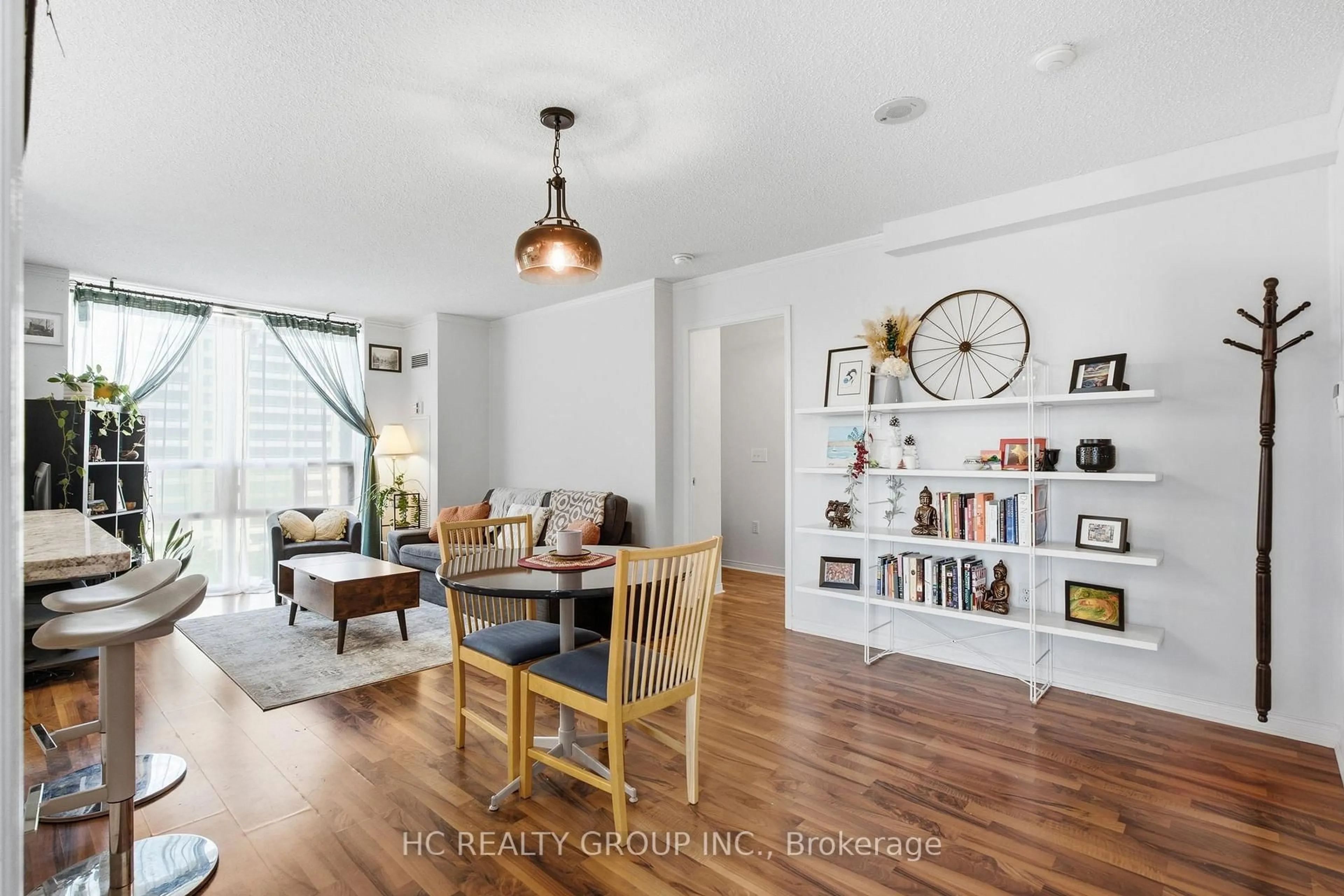 Living room with furniture, wood/laminate floor for 17 Michael Power Pl #713, Toronto Ontario M9A 5G5