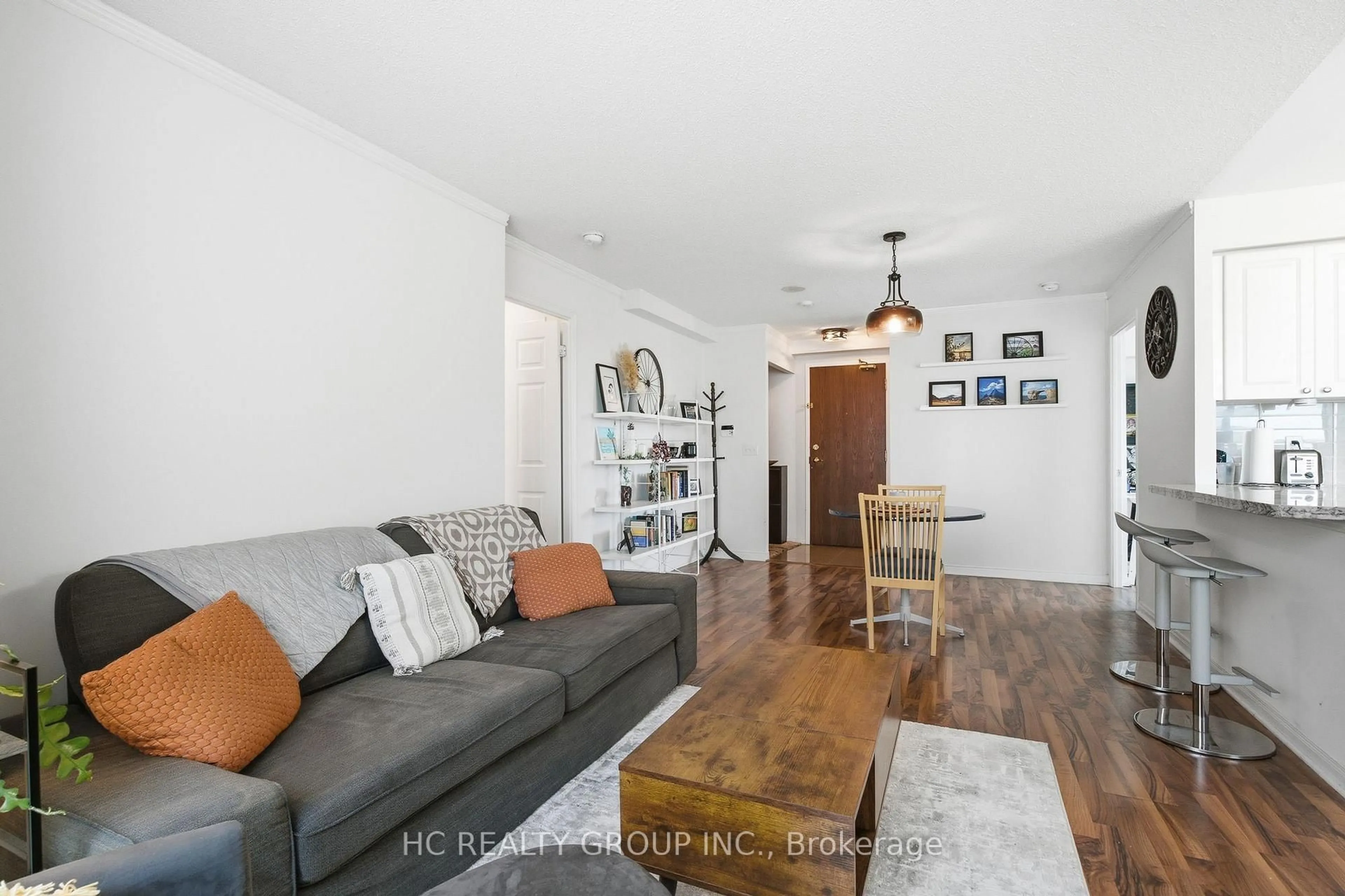 Living room with furniture, wood/laminate floor for 17 Michael Power Pl #713, Toronto Ontario M9A 5G5