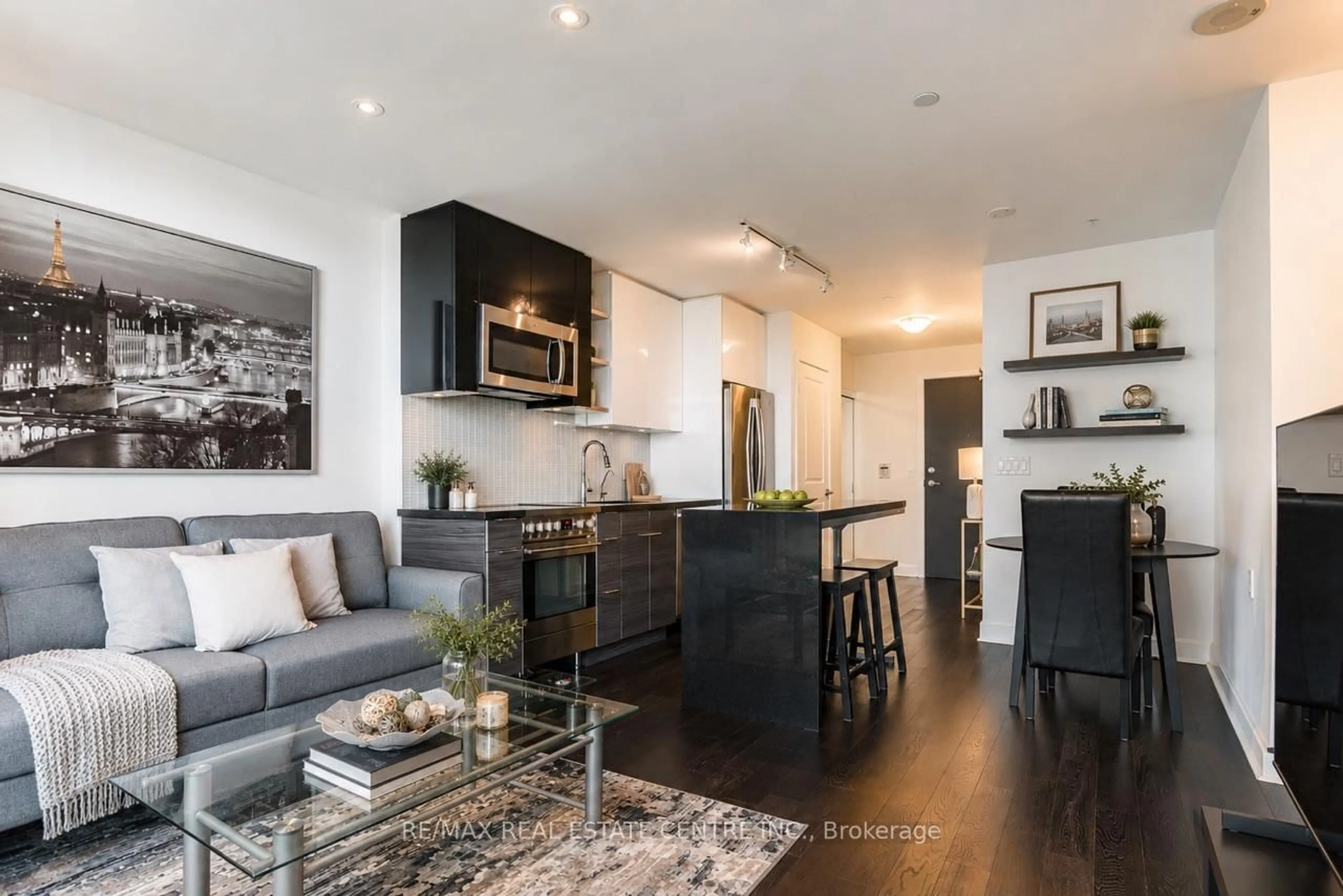 Open concept kitchen, wood/laminate floor for 33 Shore Breeze Dr #2102, Toronto Ontario M8V 0G1