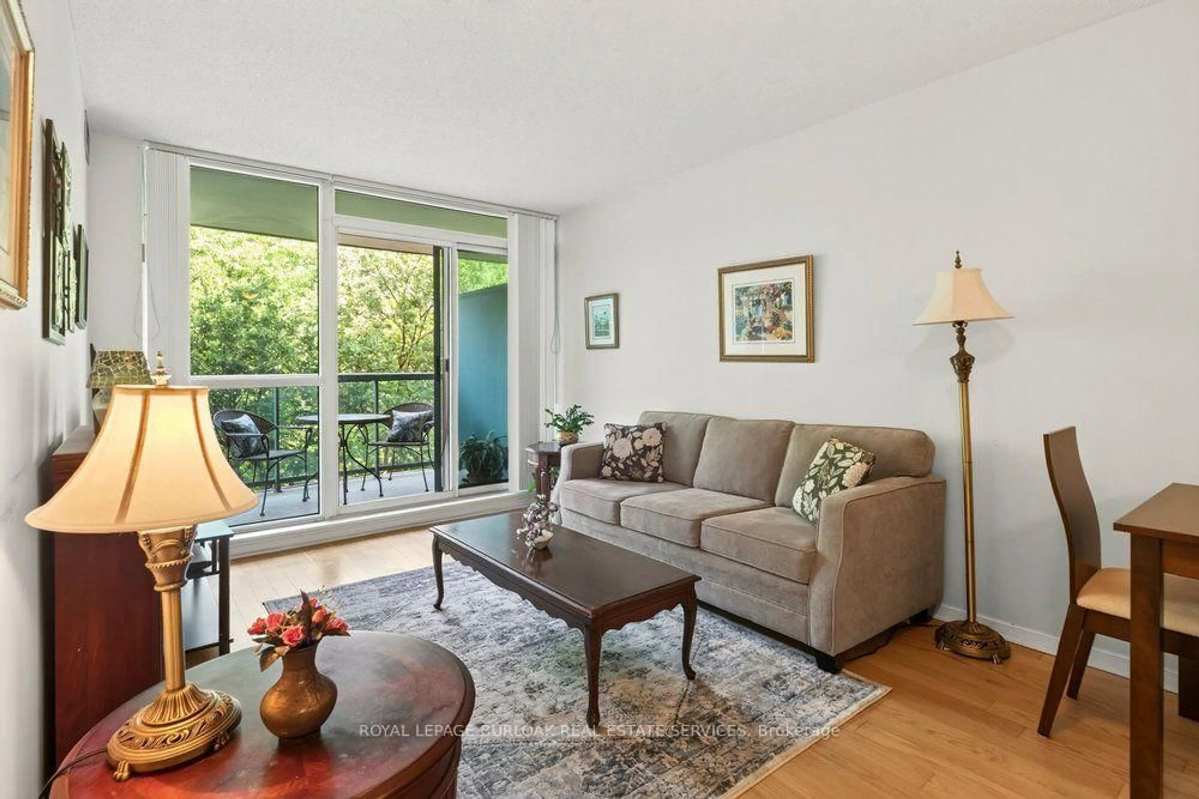 Living room with furniture, wood/laminate floor for 2565 Erin Centre Blvd #402, Mississauga Ontario L5M 6Z8