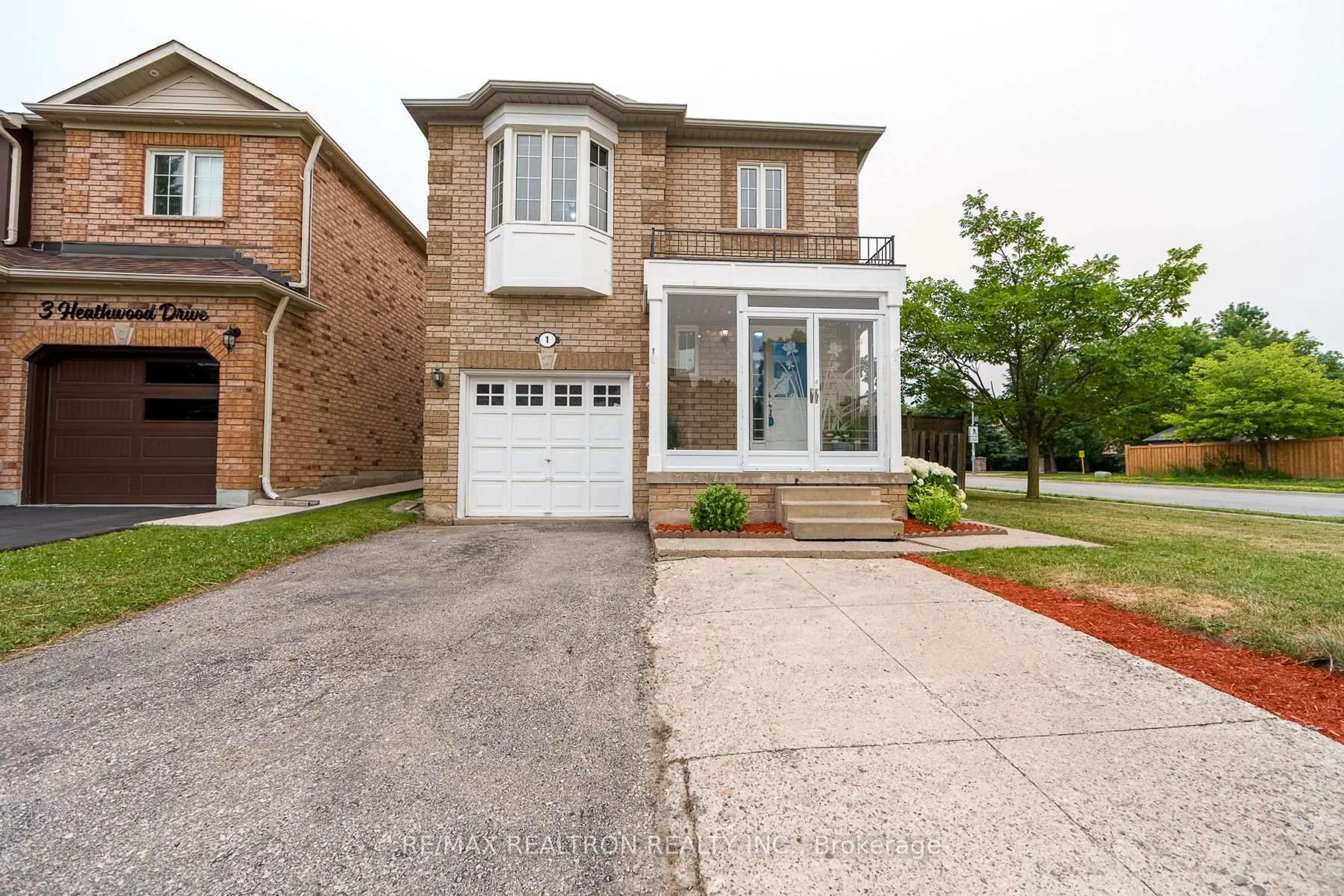 Home with brick exterior material, street for 1 Heathwood Dr, Brampton Ontario L7A 1Z6