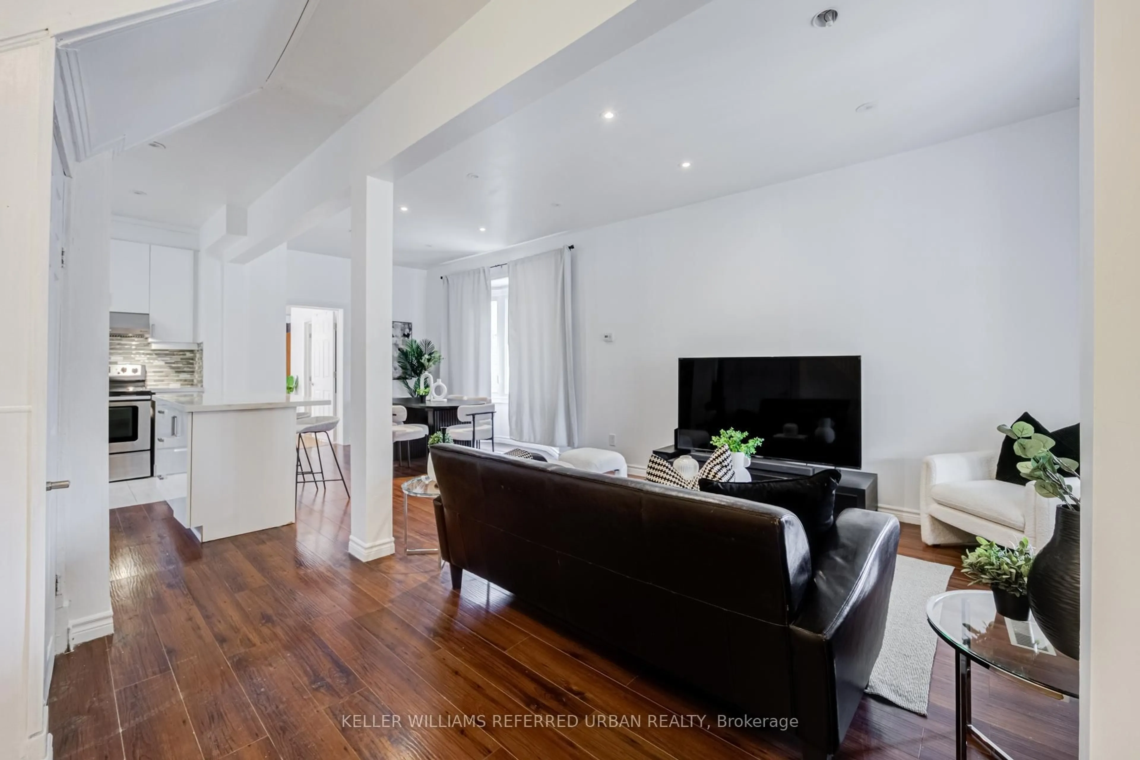 Living room with furniture, wood/laminate floor for 107 Twenty Fourth St, Toronto Ontario M8V 3N7