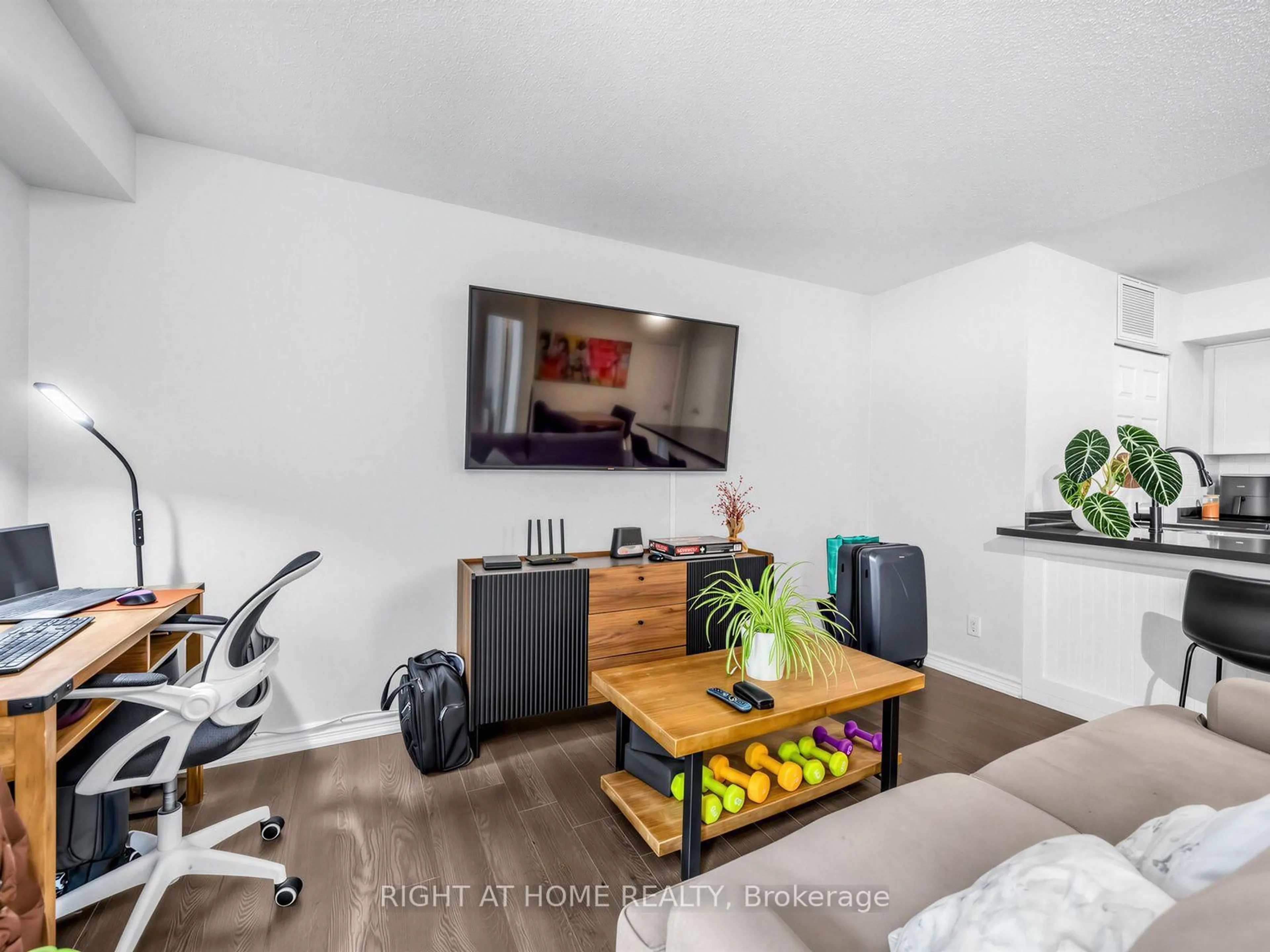 Living room with furniture, wood/laminate floor for 95 The Queensway #61, Toronto Ontario M6S 5A7