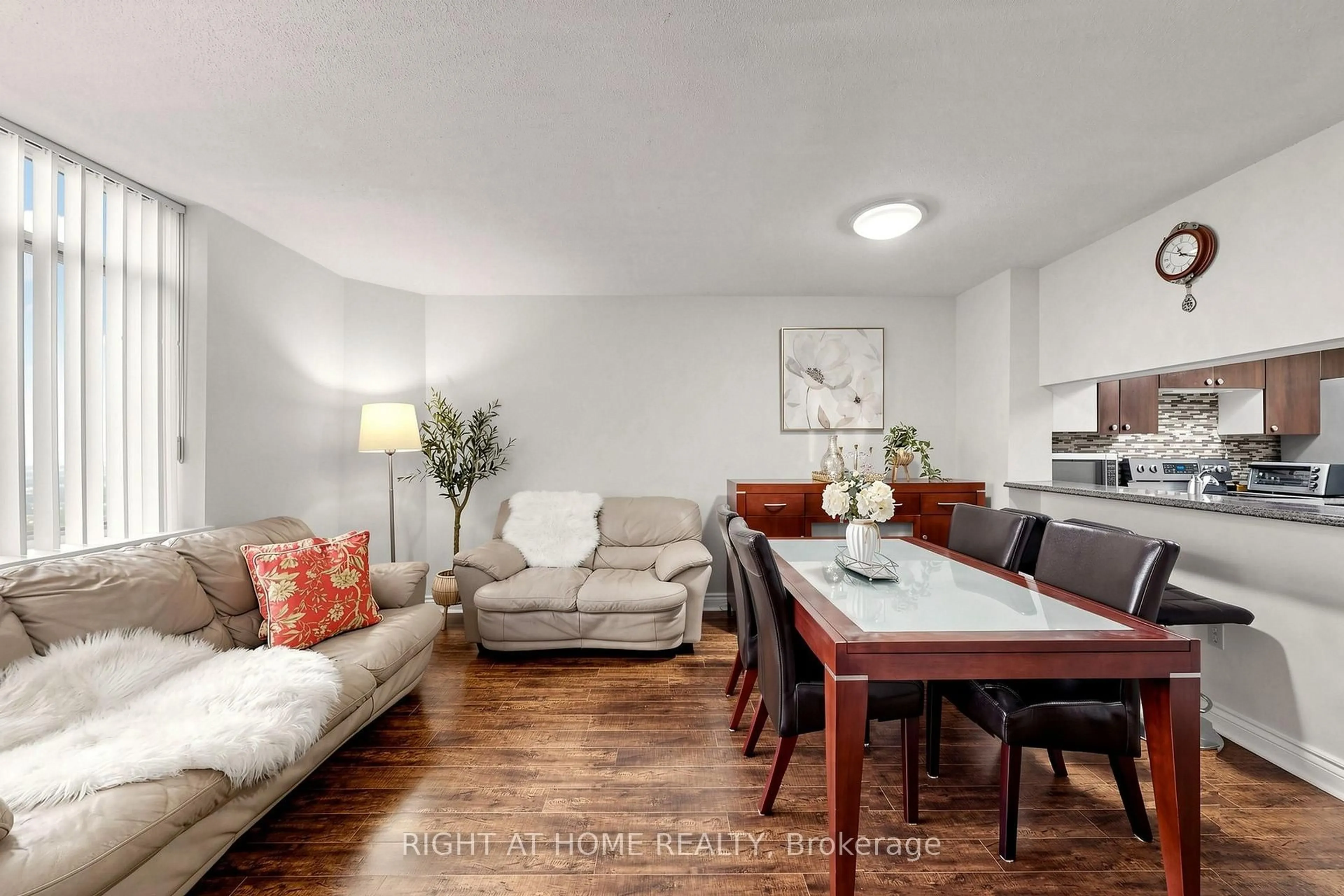 Living room with furniture, wood/laminate floor for 300 Webb Dr #PH9, Mississauga Ontario L5B 3W3