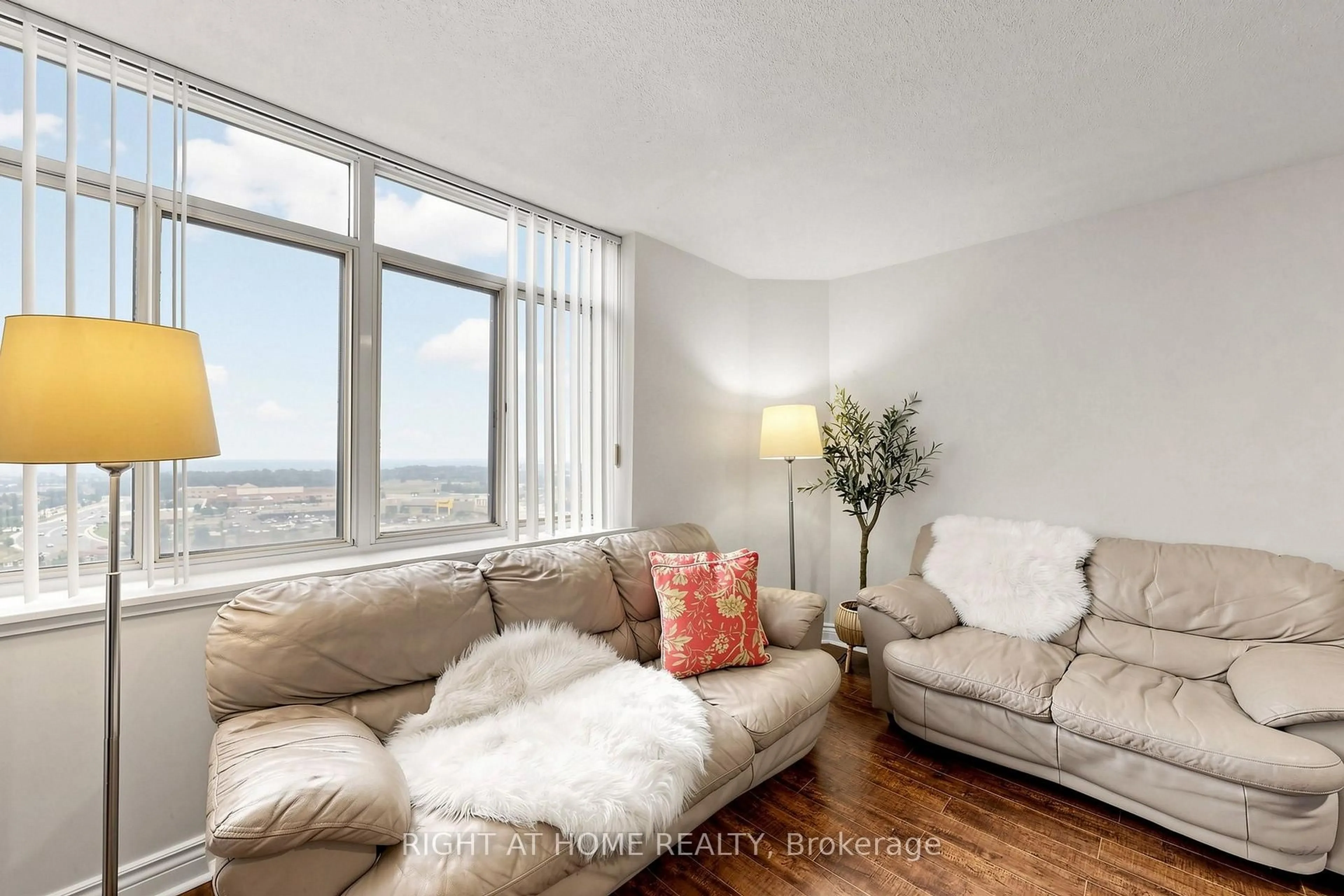 Living room with furniture, wood/laminate floor for 300 Webb Dr #PH9, Mississauga Ontario L5B 3W3