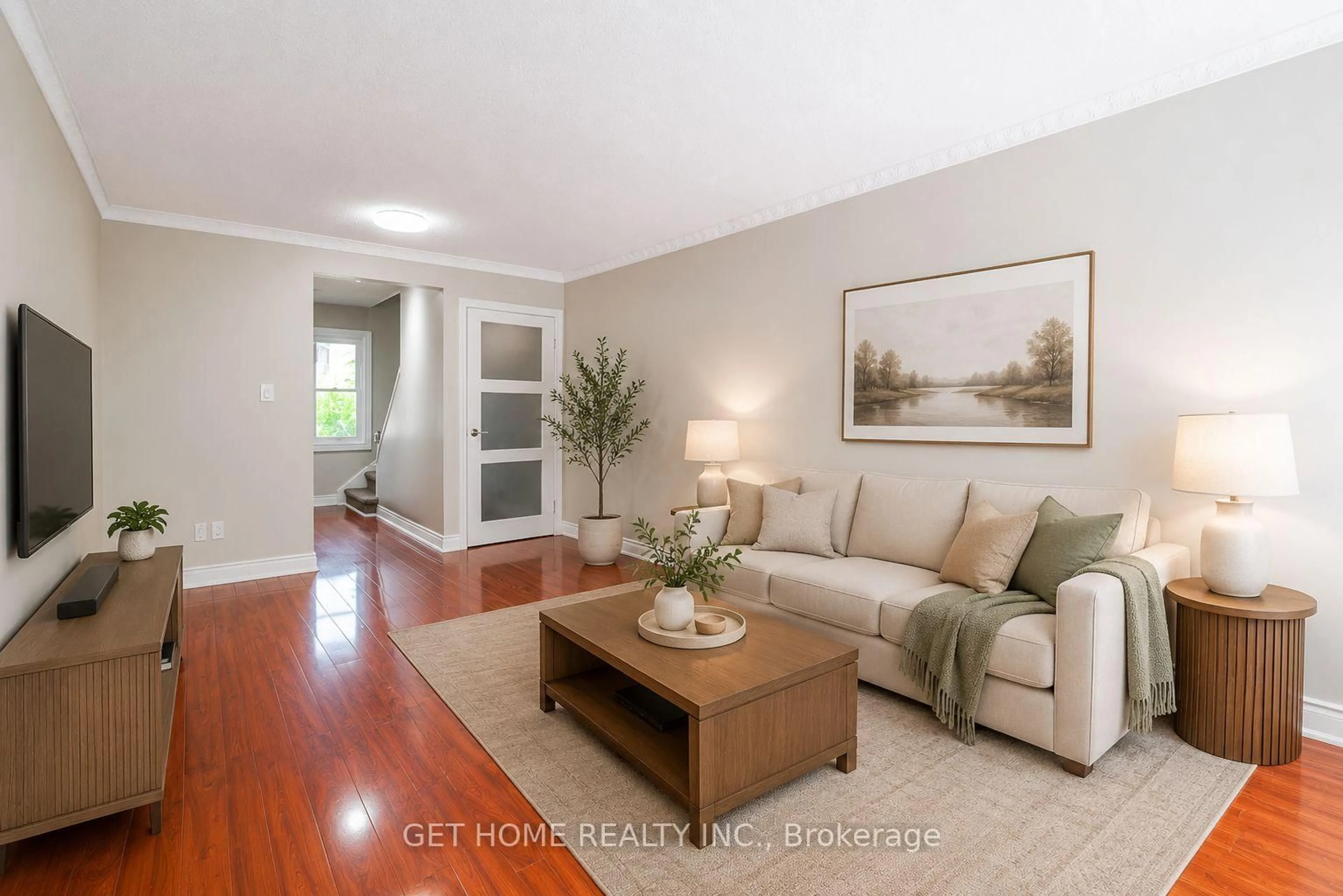 Living room with furniture, wood/laminate floor for 2185 Fairchild Blvd ##23, Burlington Ontario L7P 3P6