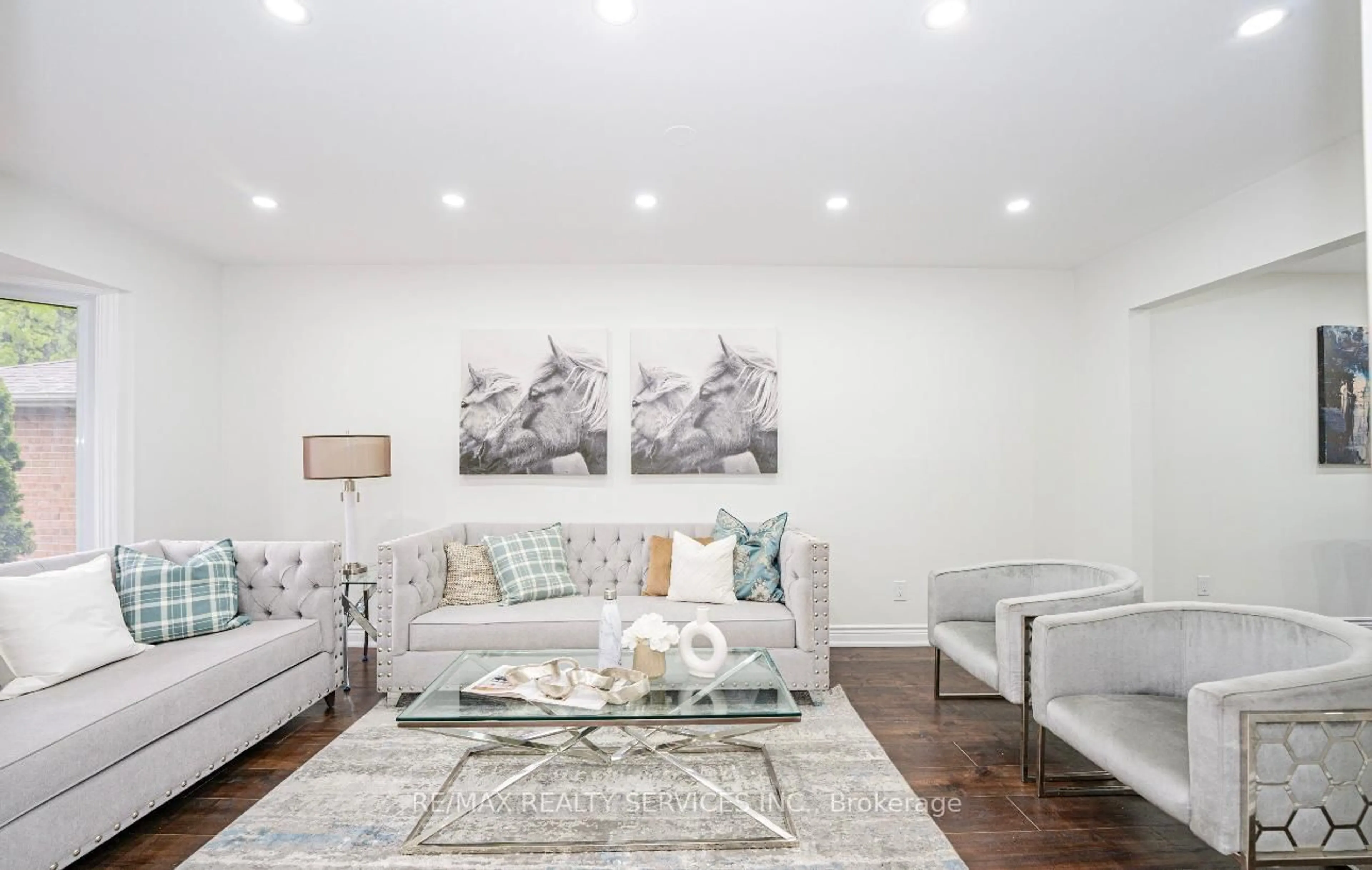 Living room with furniture, wood/laminate floor for 14 Conover Crt, Brampton Ontario L6Y 3J5