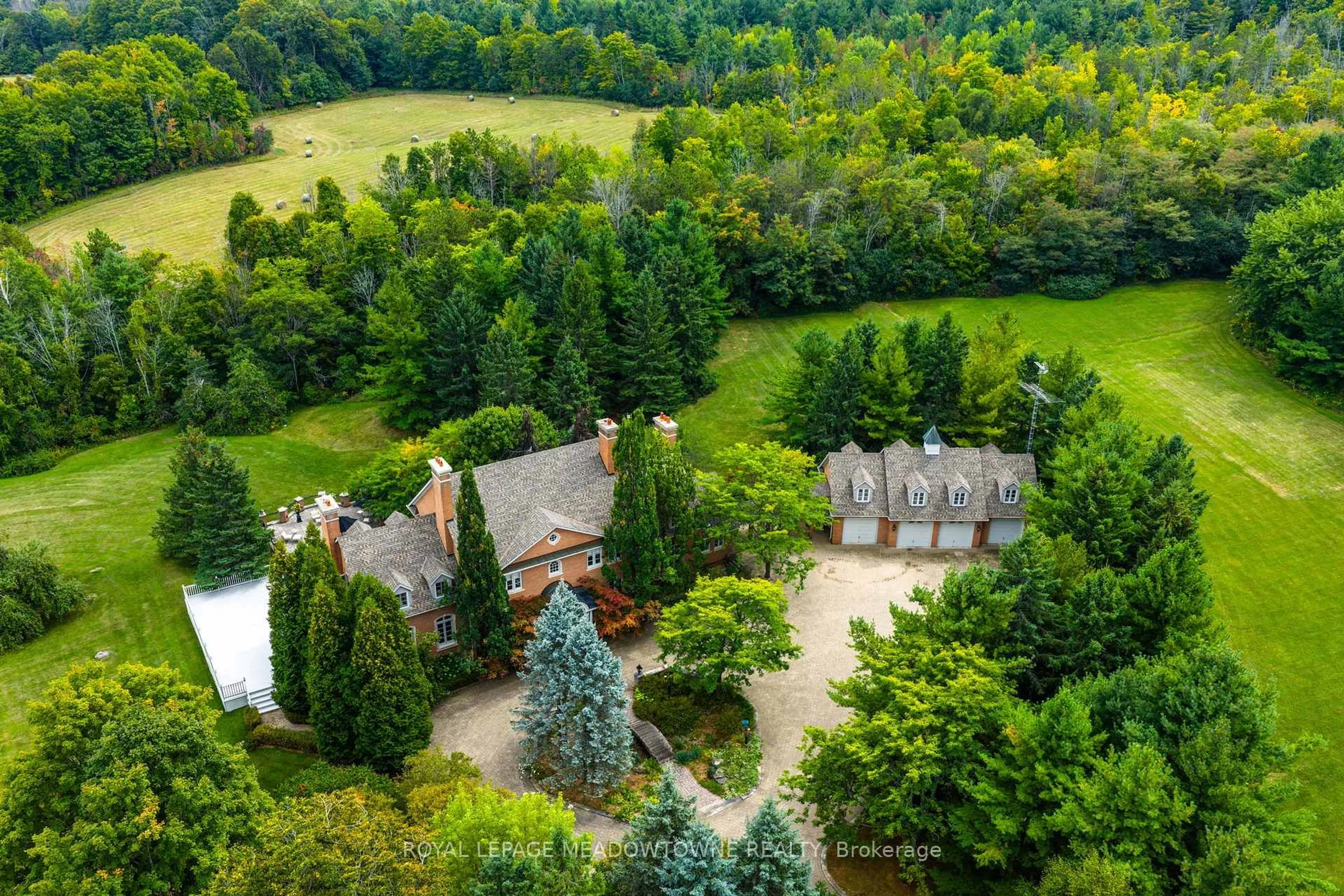 A pic from outside/outdoor area/front of a property/back of a property/a pic from drone, forest/trees view for 2097 Grange Sdrd, Caledon Ontario L7C 0E7