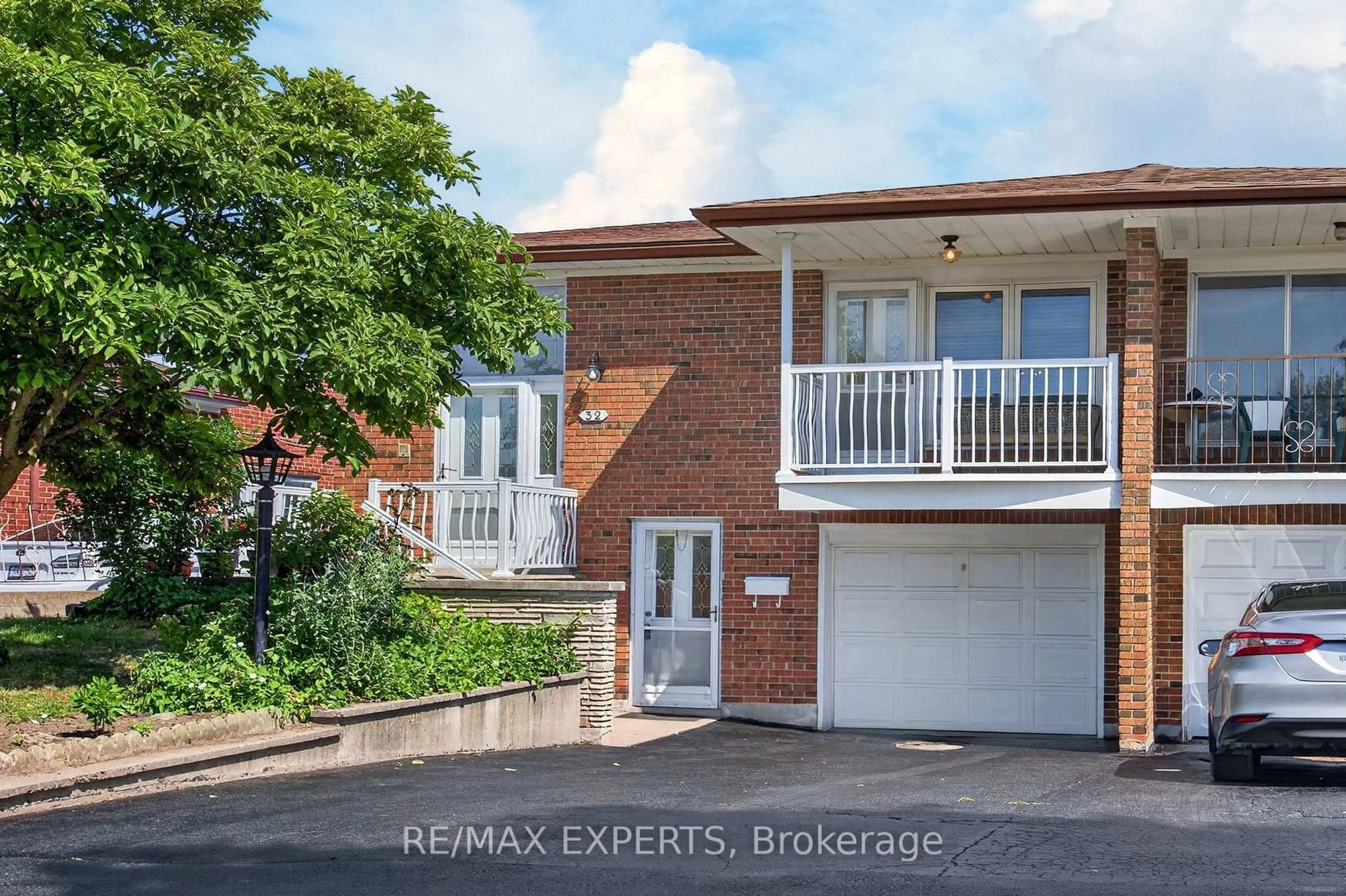 Home with brick exterior material, street for 32 Firenza Dr, Toronto Ontario M9L 1A5