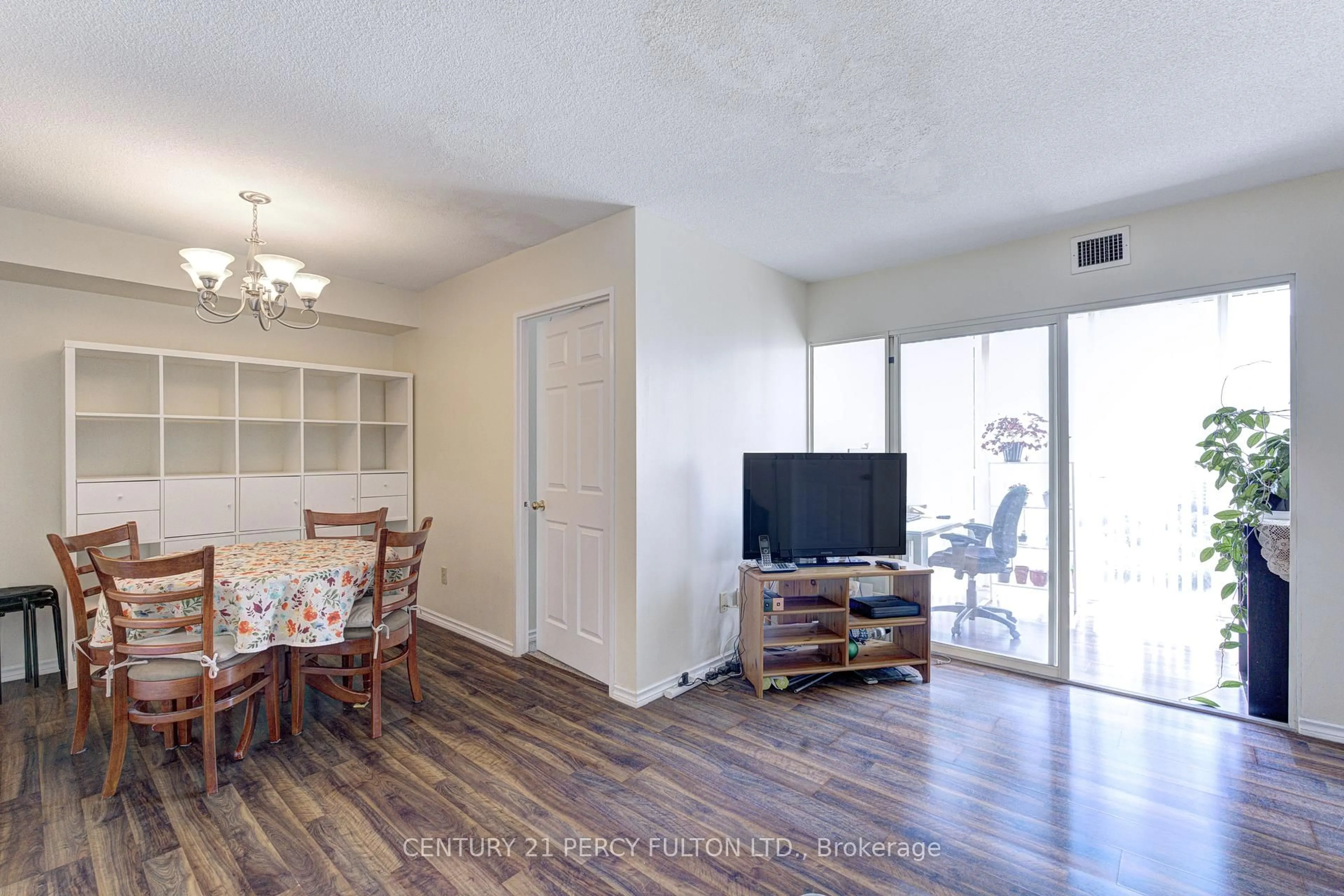 Living room with furniture, wood/laminate floor for 285 Enfield Pl #2006, Mississauga Ontario L5B 3Y6