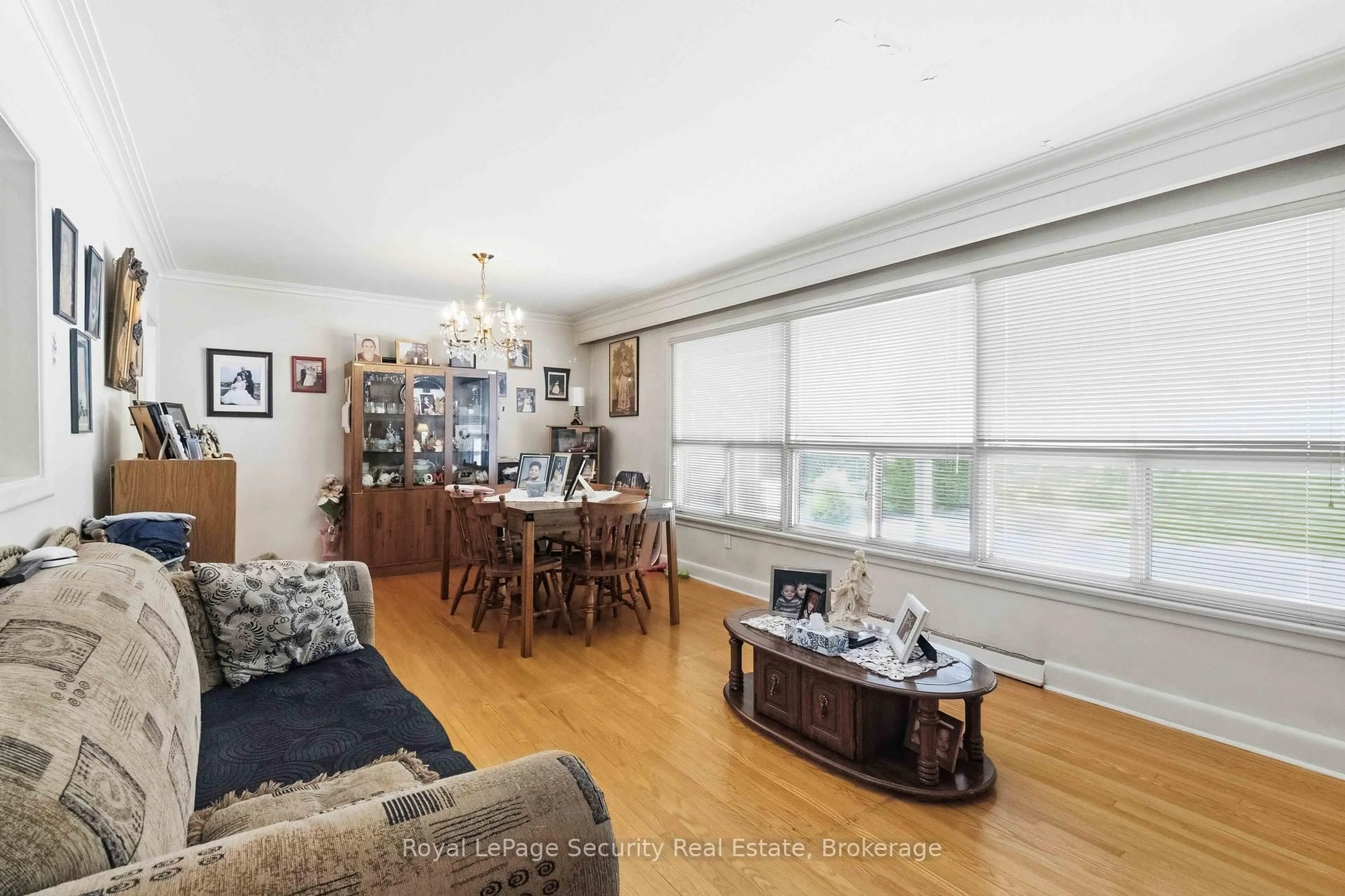 Living room with furniture, wood/laminate floor for 73 St Andrews Blvd, Toronto Ontario M9R 1W4