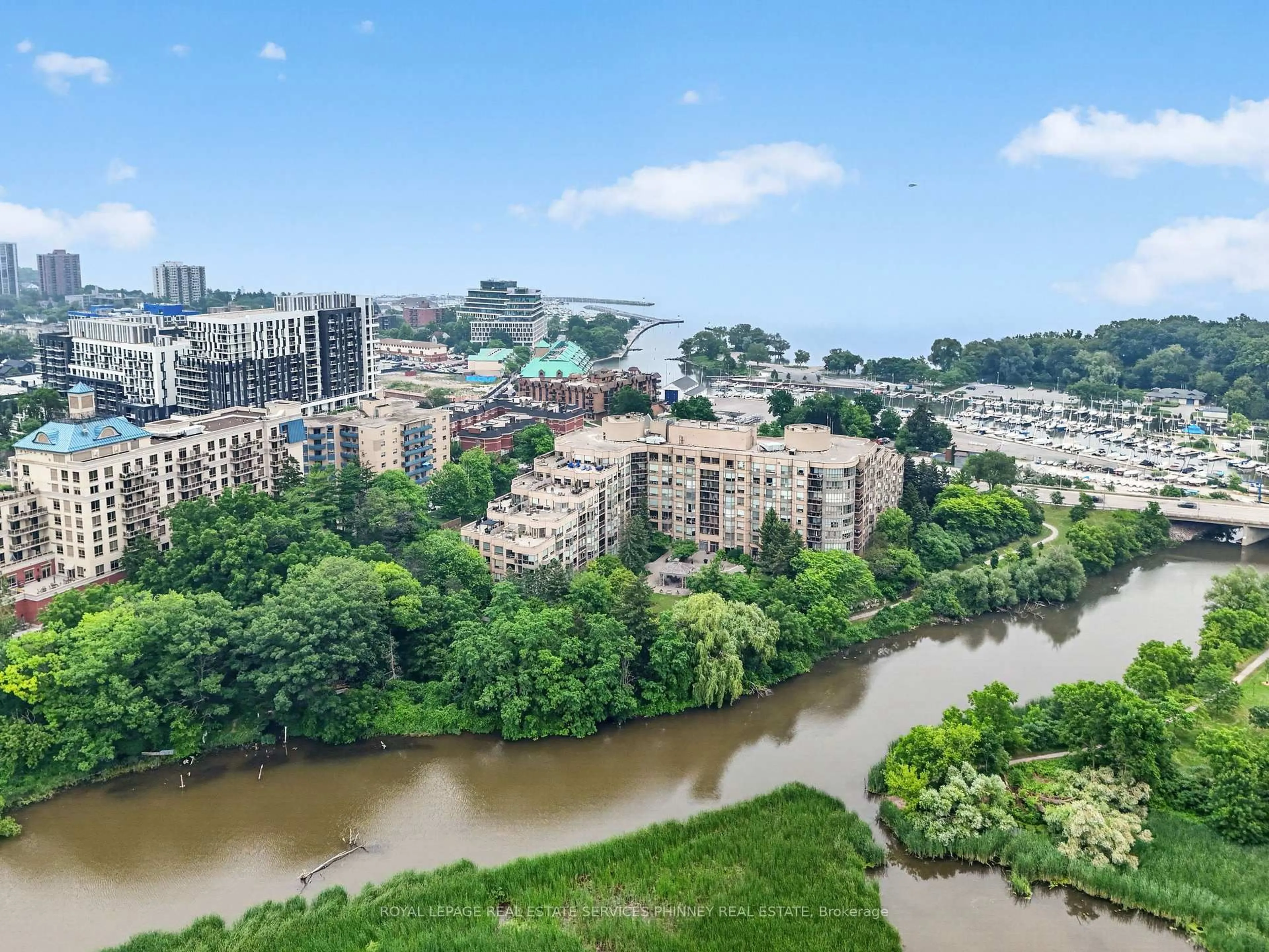 A pic from outside/outdoor area/front of a property/back of a property/a pic from drone, water/lake/river/ocean view for 2511 Lakeshore Rd #407, Oakville Ontario L6L 6L9