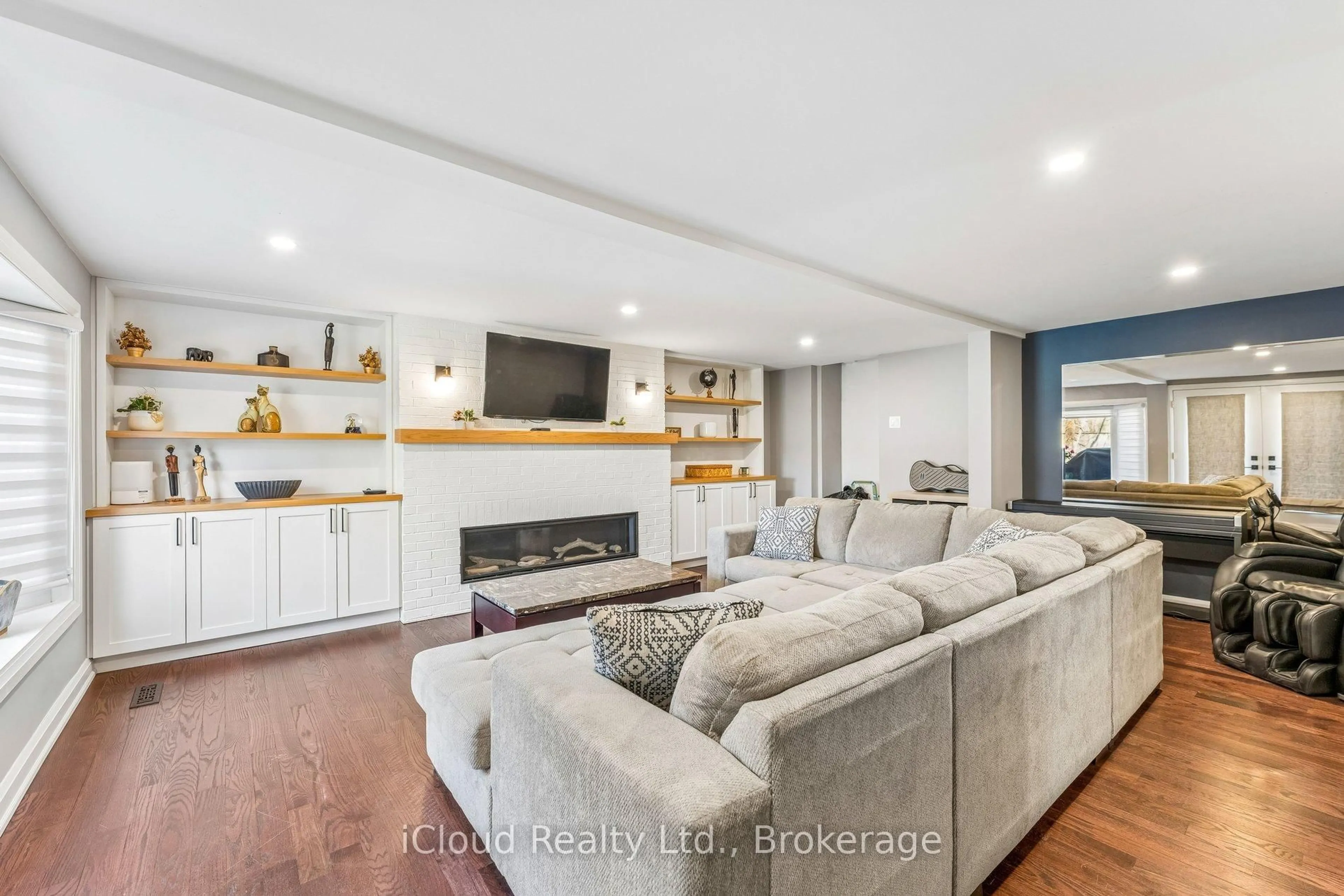Living room with furniture, wood/laminate floor for 43 Ferndale Cres, Brampton Ontario L6W 1G1