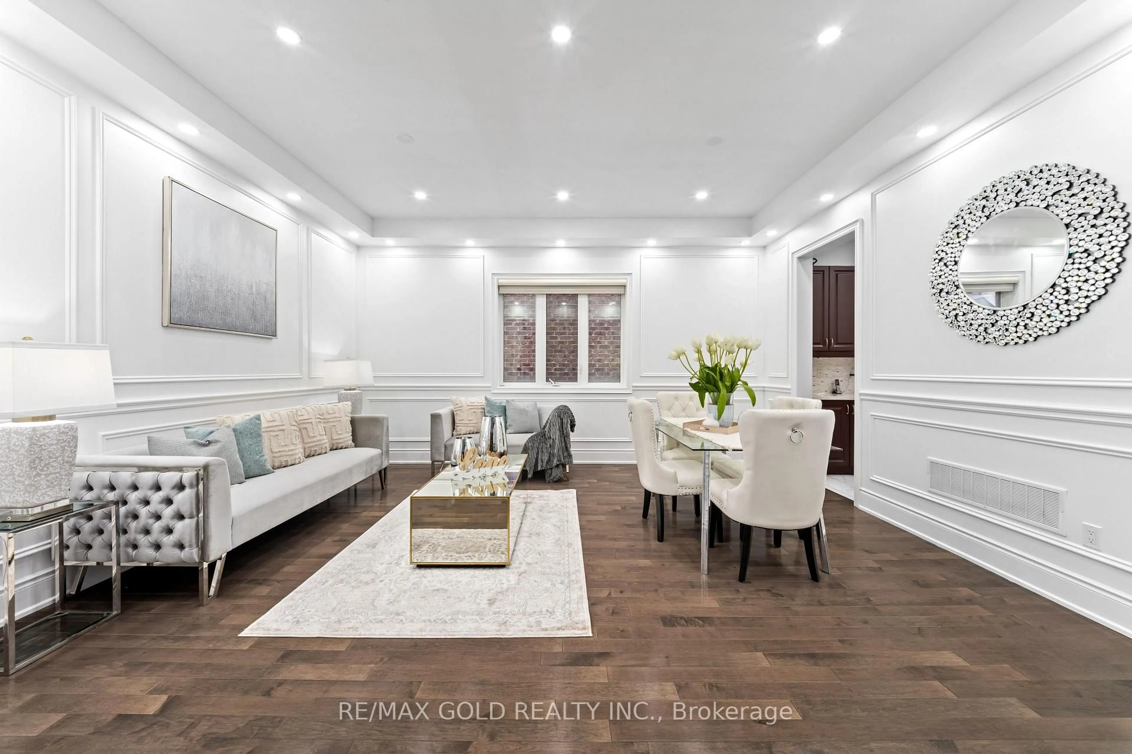 Living room with furniture, wood/laminate floor for 73 Squire Ellis Dr, Brampton Ontario L6P 4C2