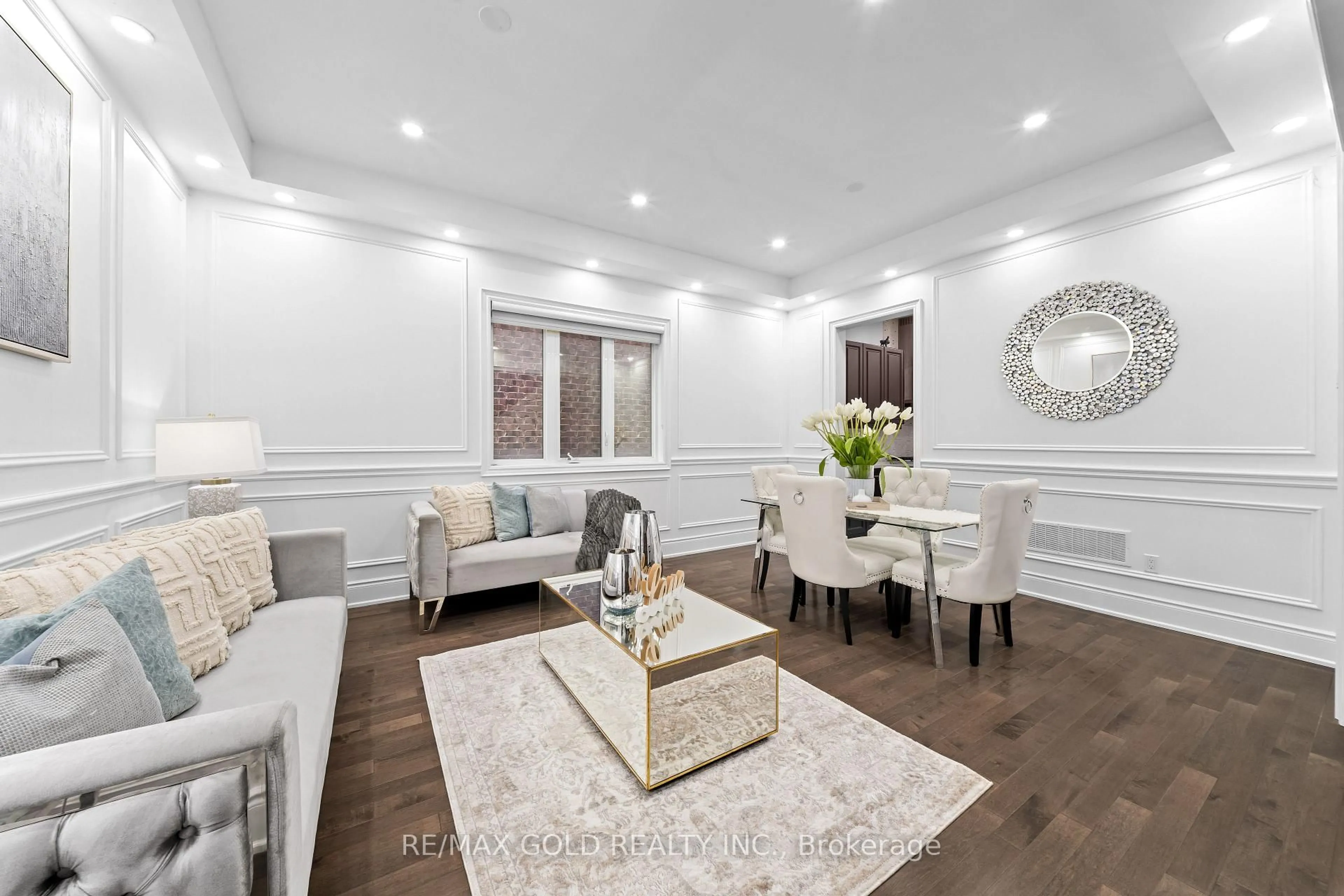 Living room with furniture, wood/laminate floor for 73 Squire Ellis Dr, Brampton Ontario L6P 4C2