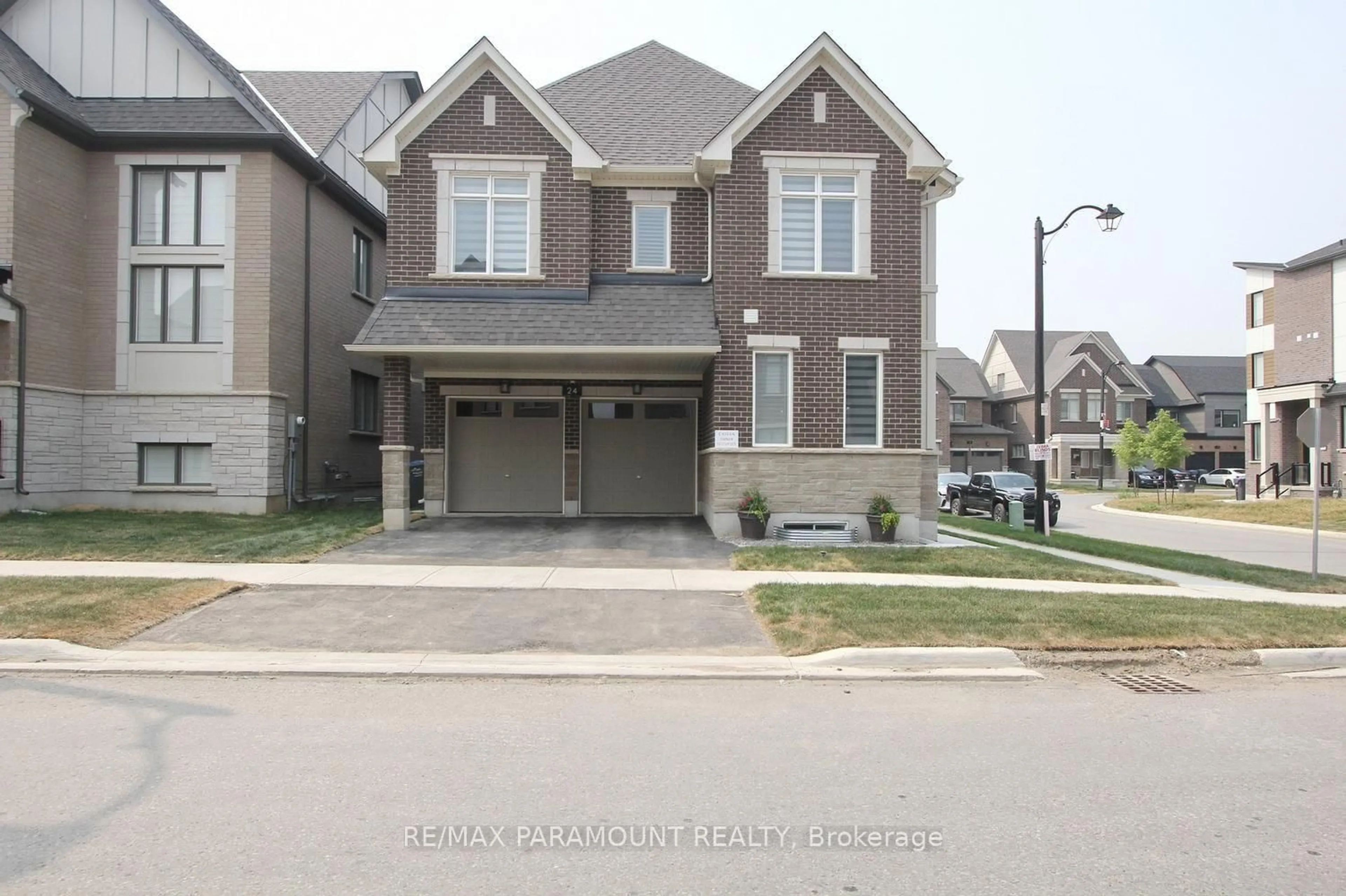Home with brick exterior material, street for 24 Kings Hill Dr, Brampton Ontario L7A 5L9
