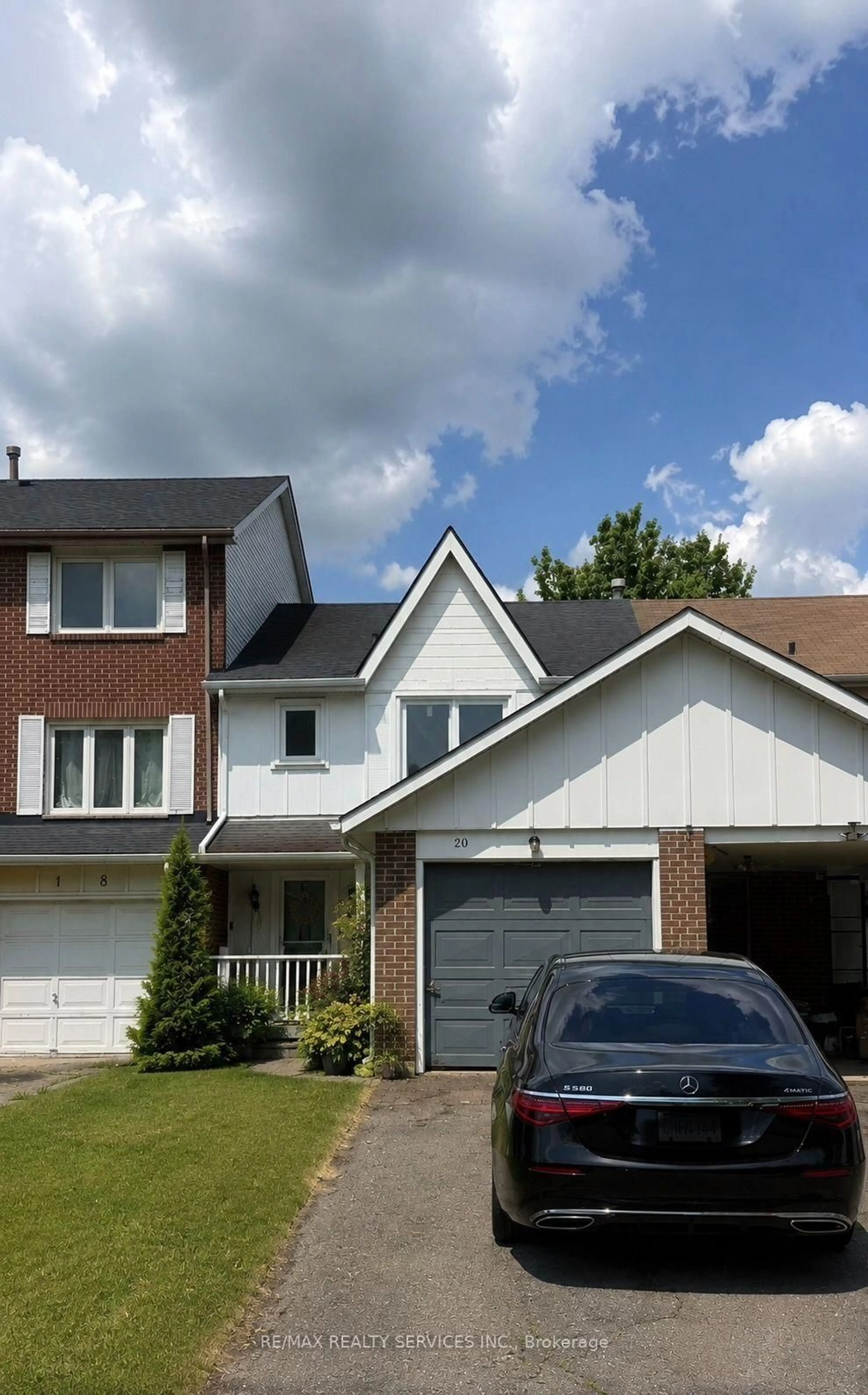Home with brick exterior material, street for 20 Lansing Sq, Brampton Ontario L6Z 1E6