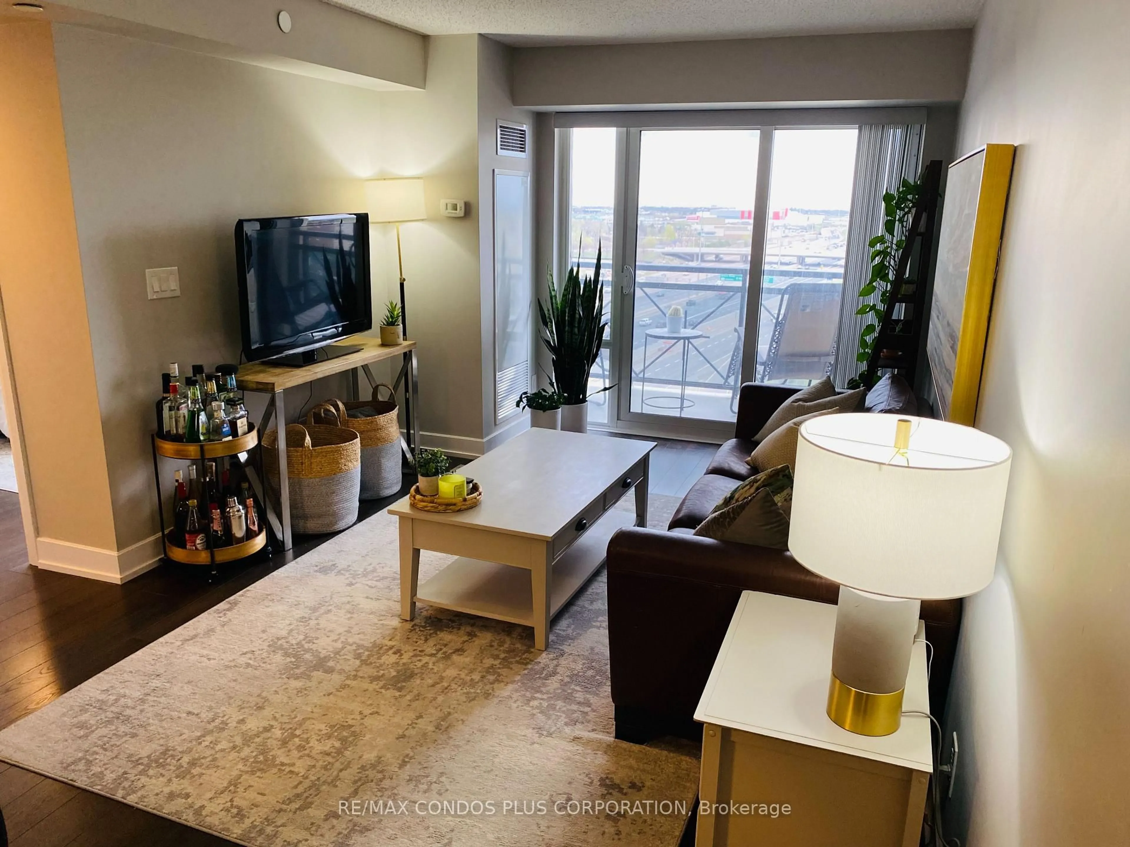 Living room with furniture, unknown for 2 Eva Rd #927, Toronto Ontario M9C 2A8
