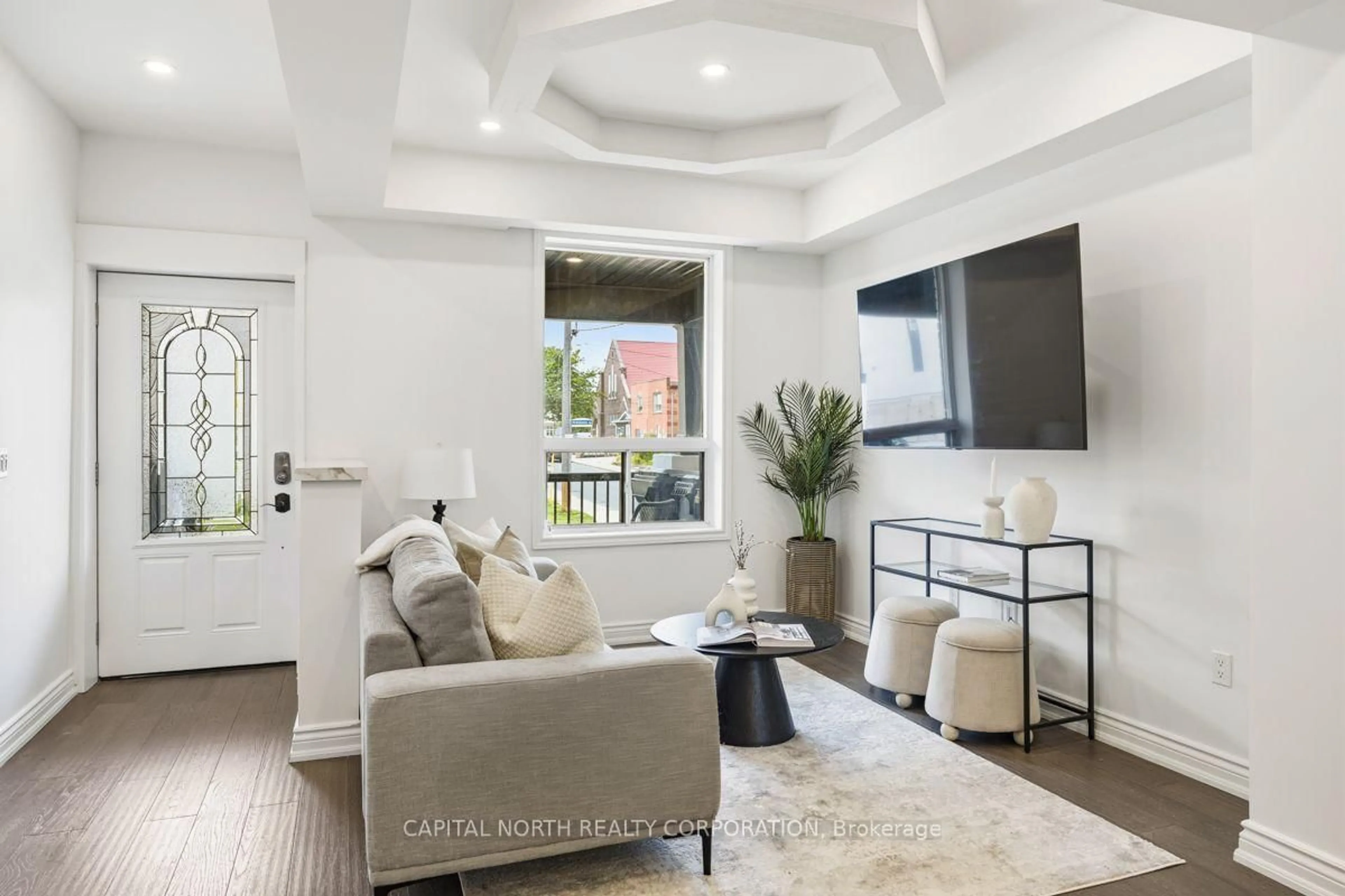 Living room with furniture, ceramic/tile floor for 219 McRoberts Ave, Toronto Ontario M6E 4P3