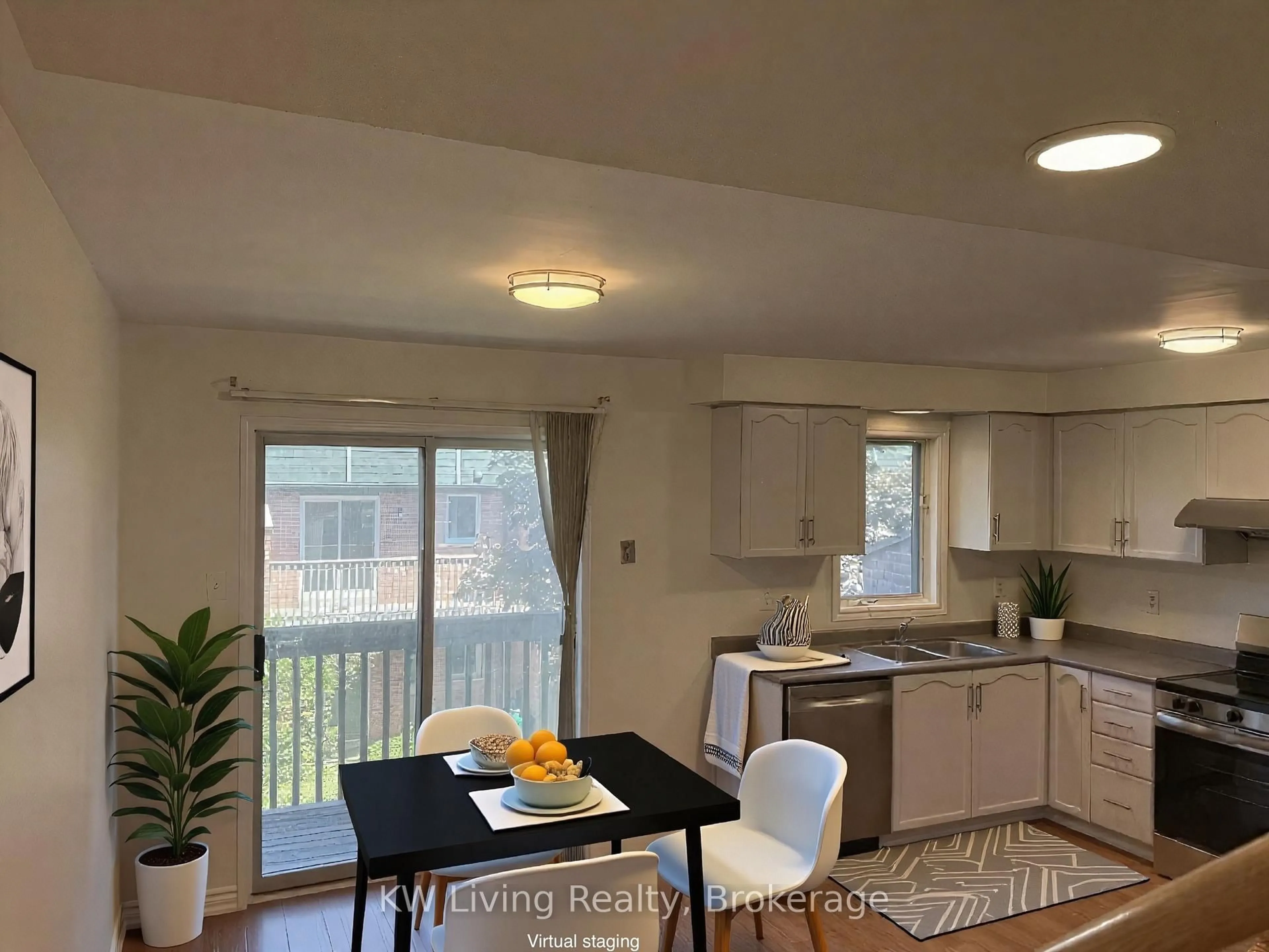 Open concept kitchen, wood/laminate floor for 2945 Thomas St #86, Mississauga Ontario L5M 6C1