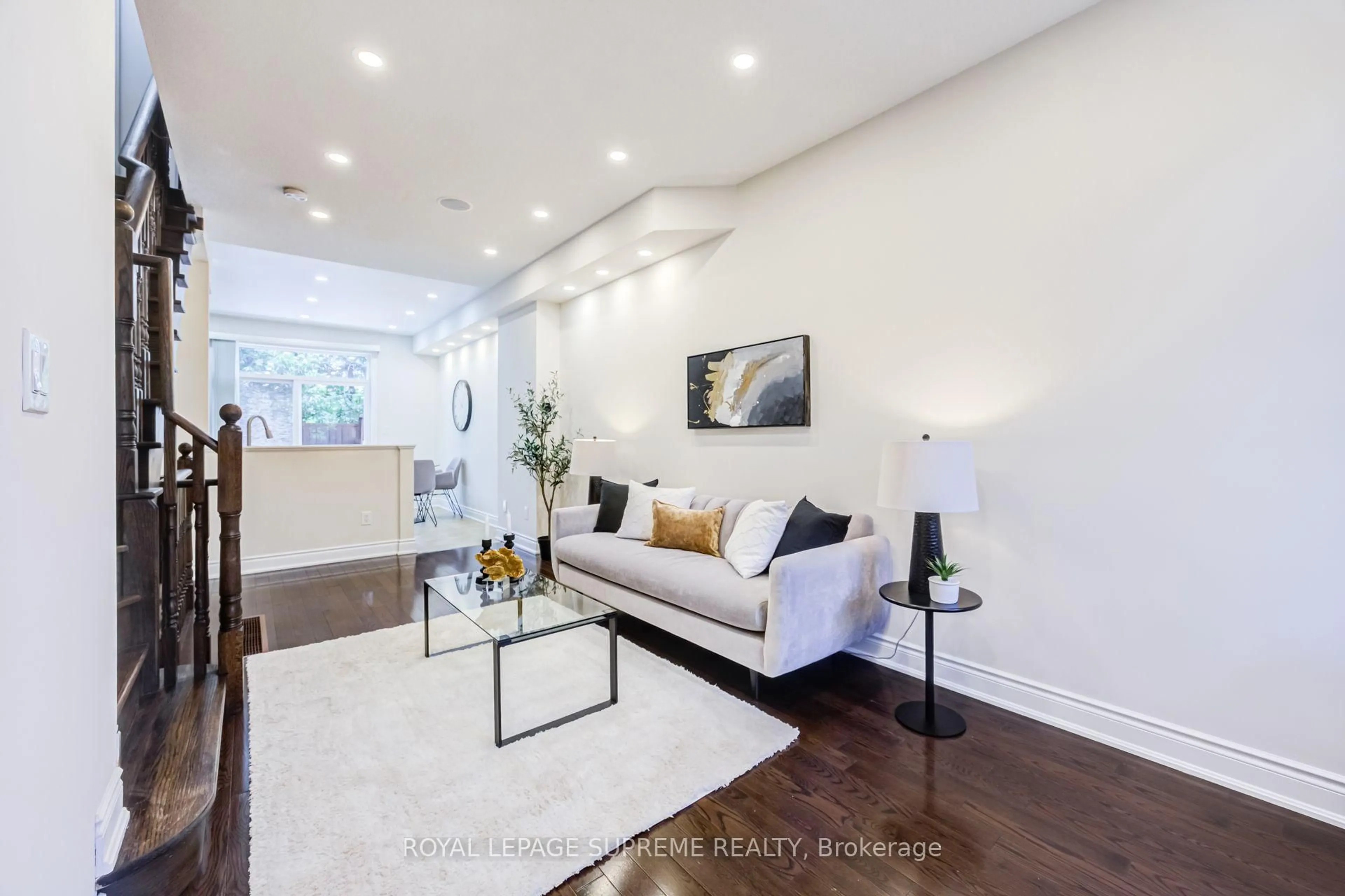 Living room with furniture, wood/laminate floor for 19B Hobden Pl, Toronto Ontario M9R 3R6