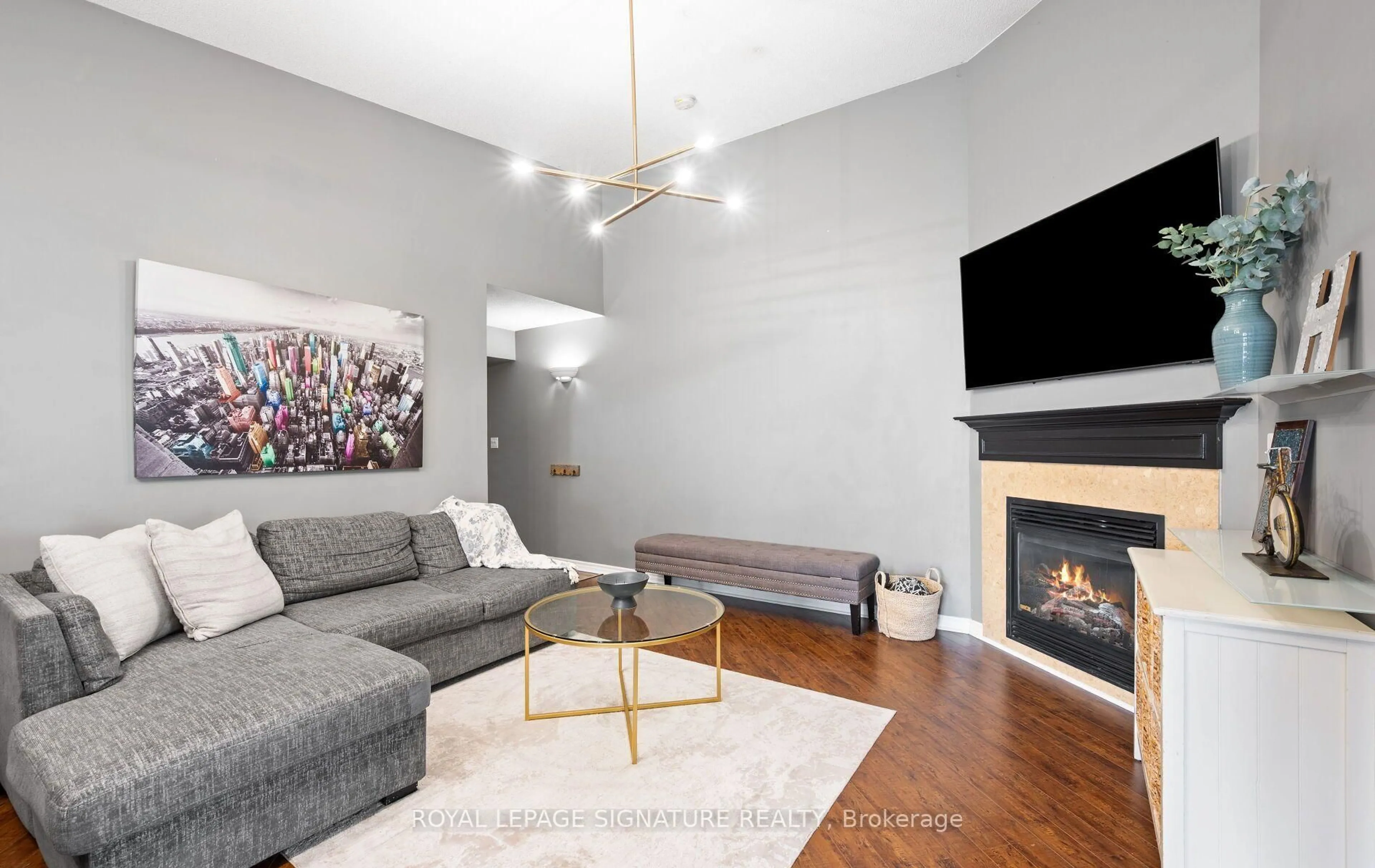 Living room with furniture, wood/laminate floor for 1491 Maple Ave #401, Milton Ontario L9T 0B8