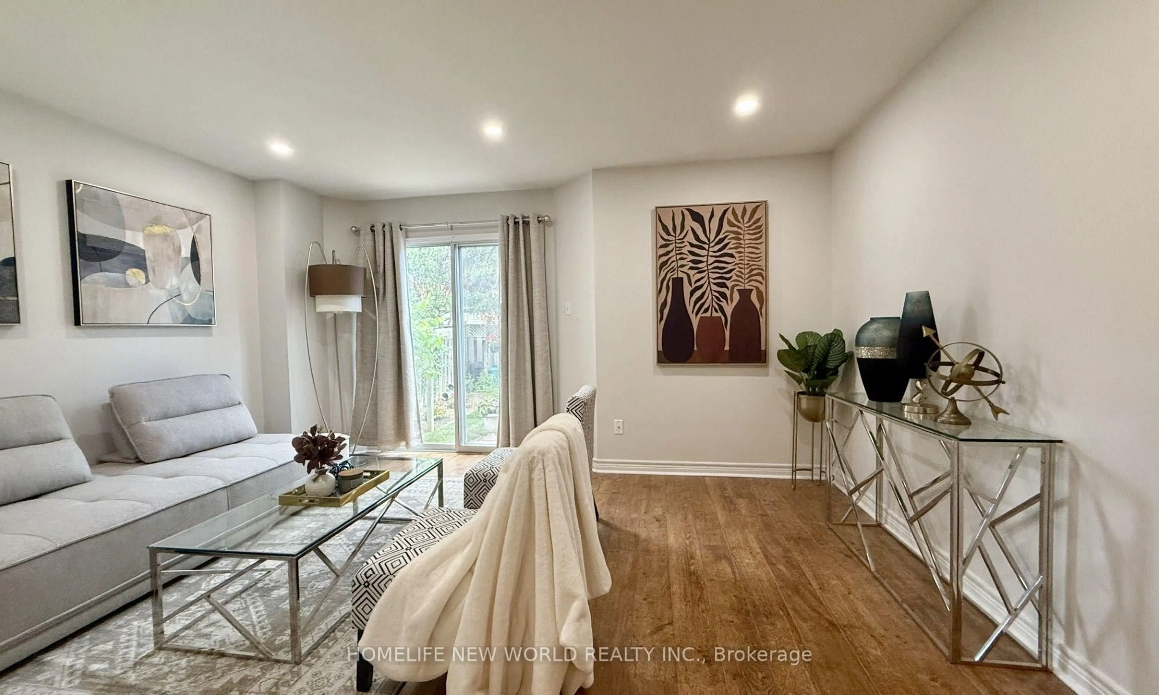 Living room with furniture, wood/laminate floor for 5666 Cortina Cres, Mississauga Ontario L4Z 3R4